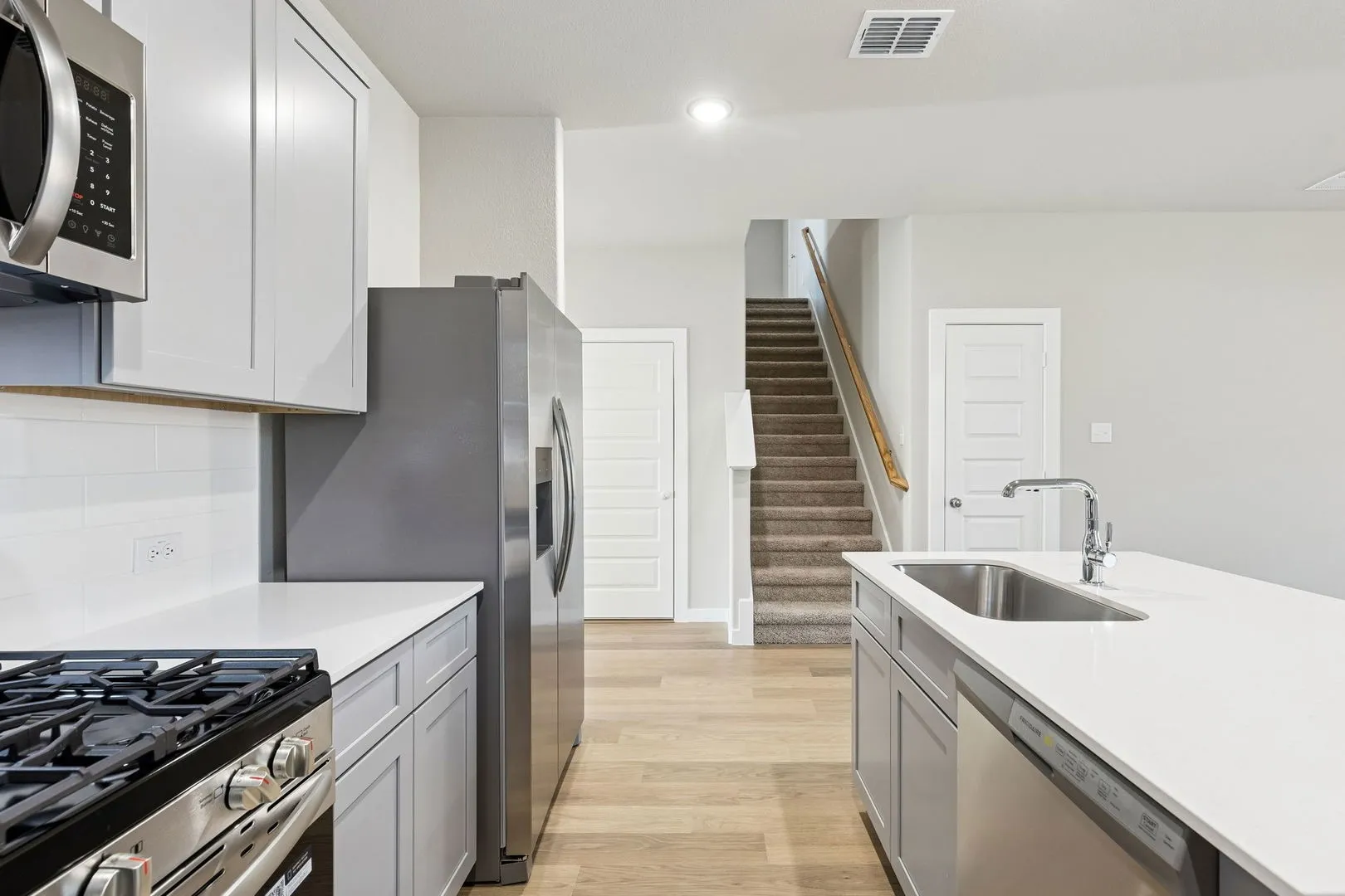 Kitchen in the Haylee home plan by Trophy Signature Homes - REPRESENTATIVE PHOTO