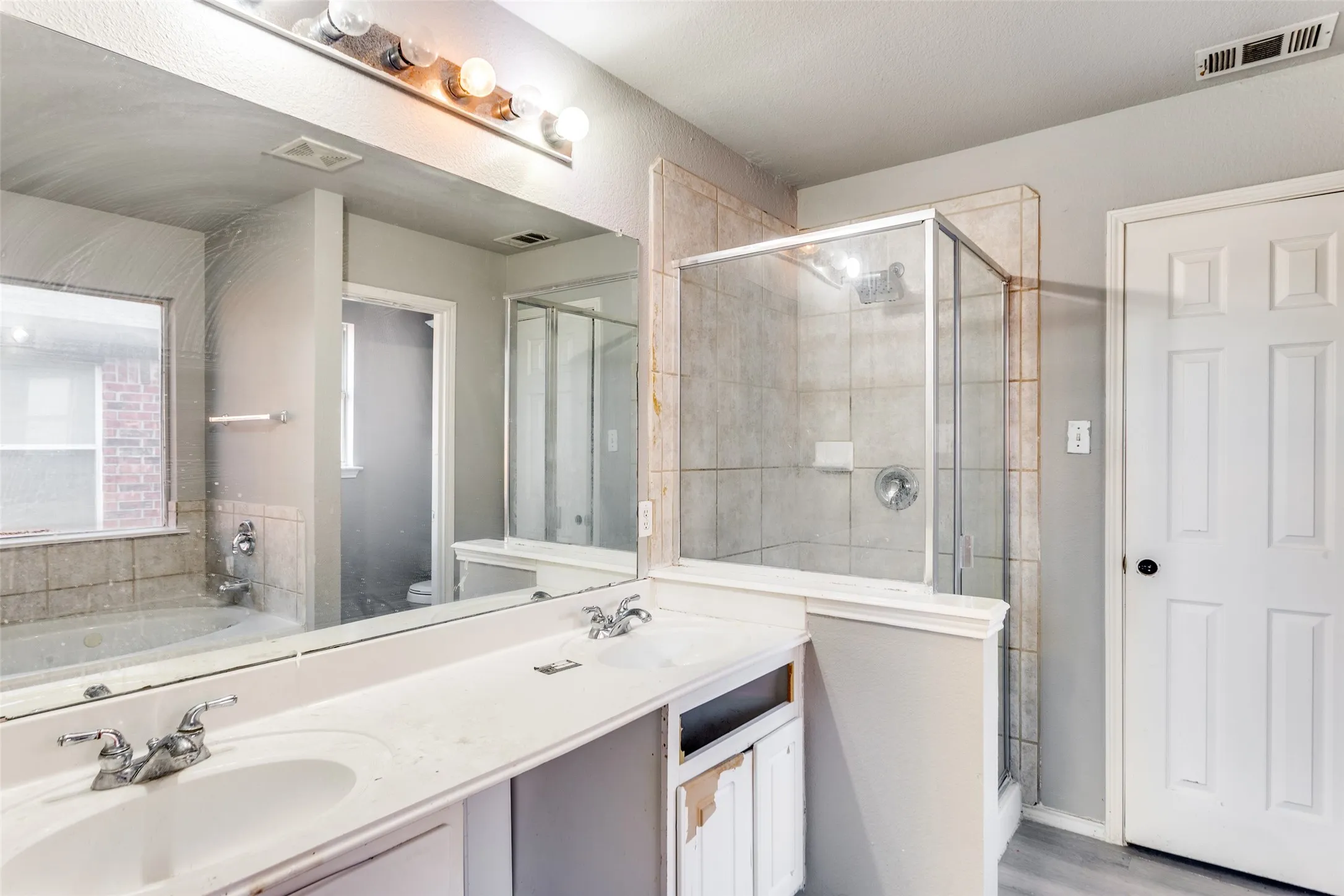 Primary bath with separate tub and shower