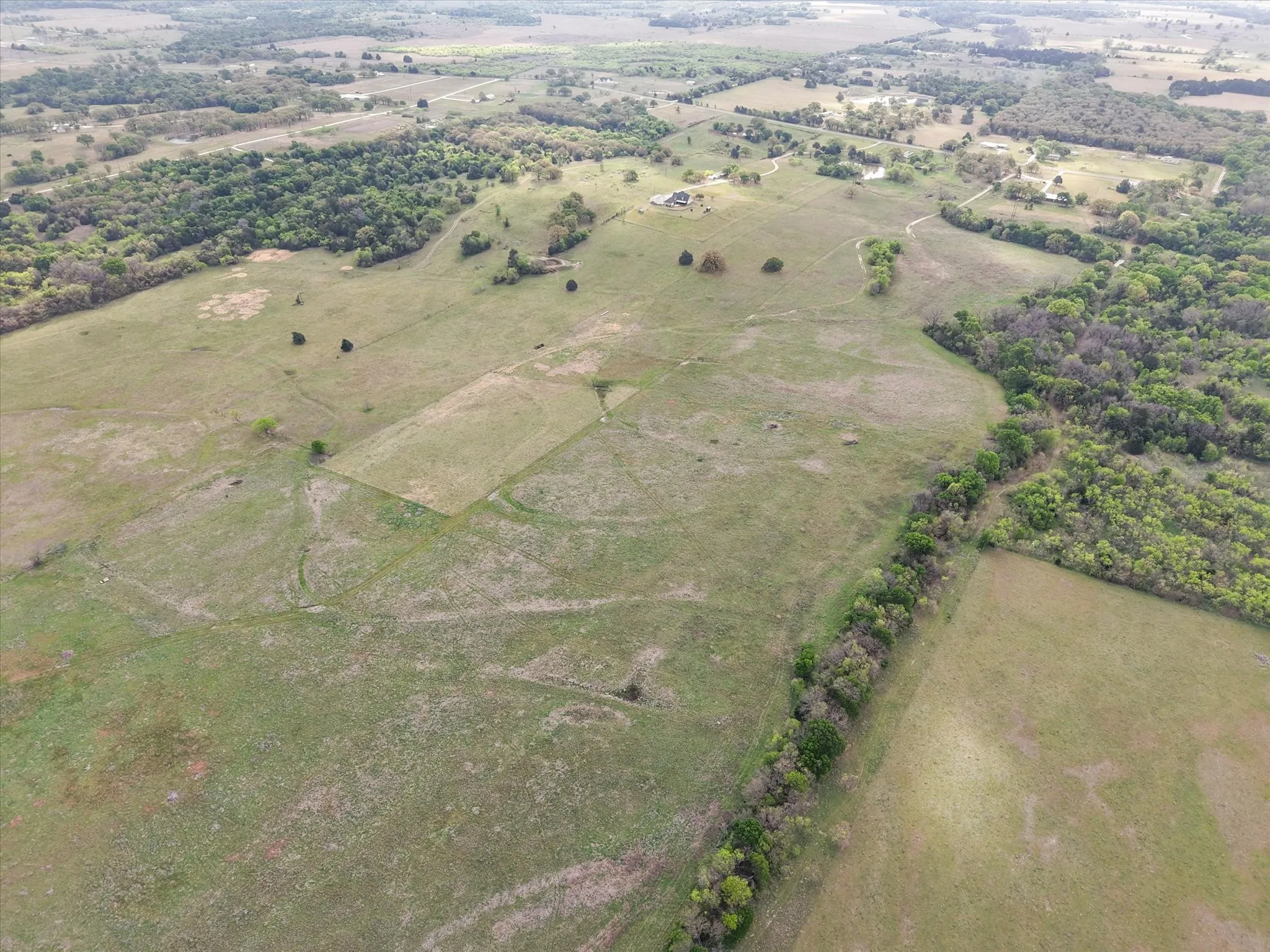 Aerial view of property's location with rural landscape