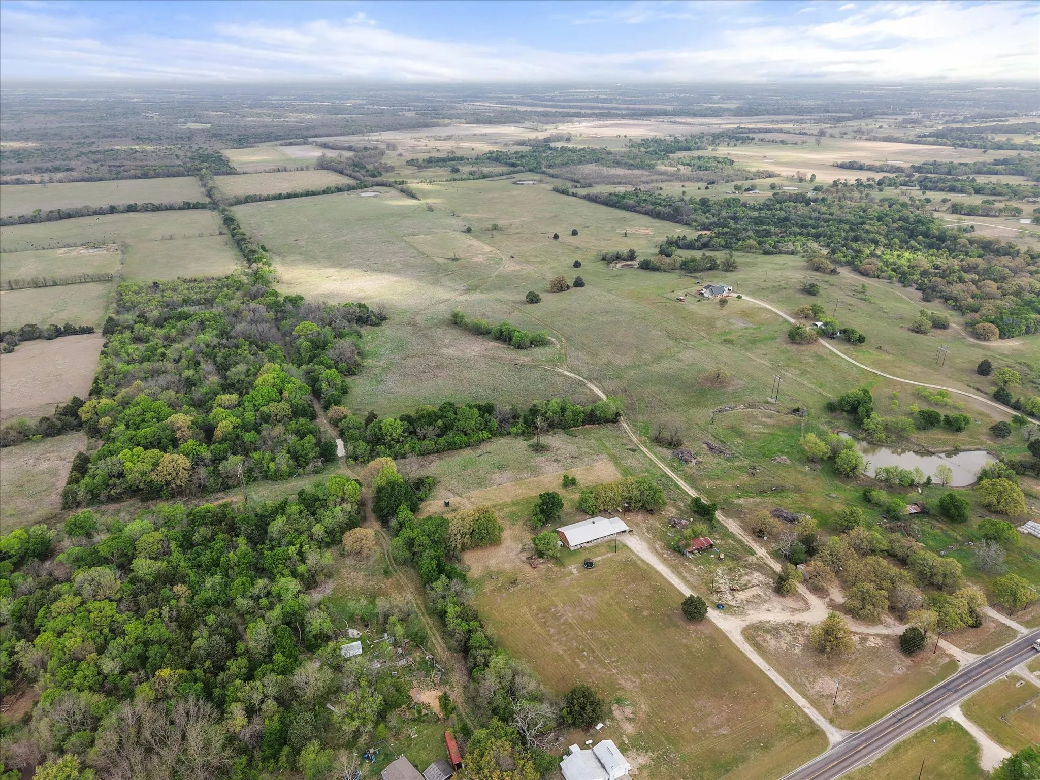 Overview of rural landscape featuring extensive farmland