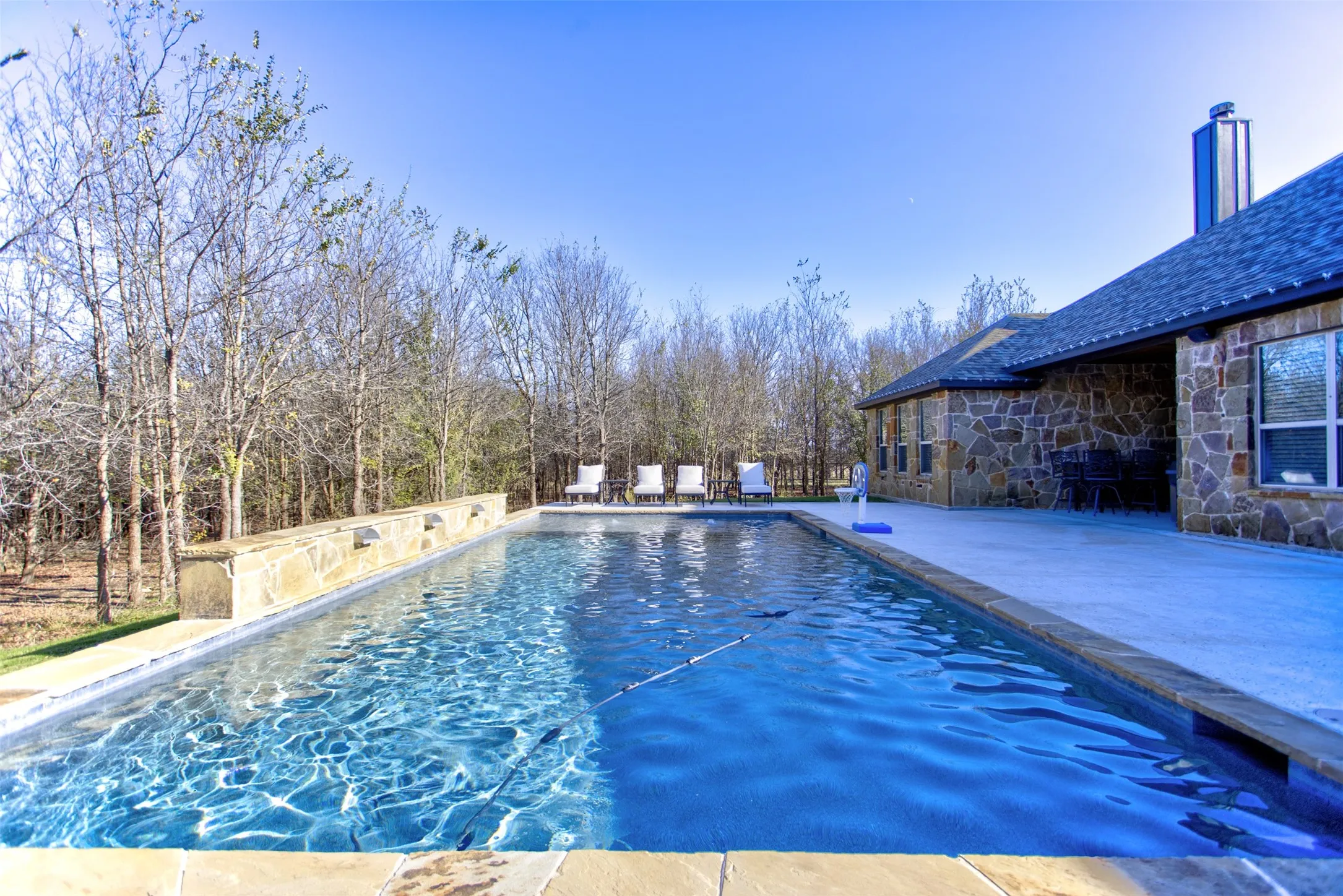 Play pool with water wall, tanning ledge & bubblers.