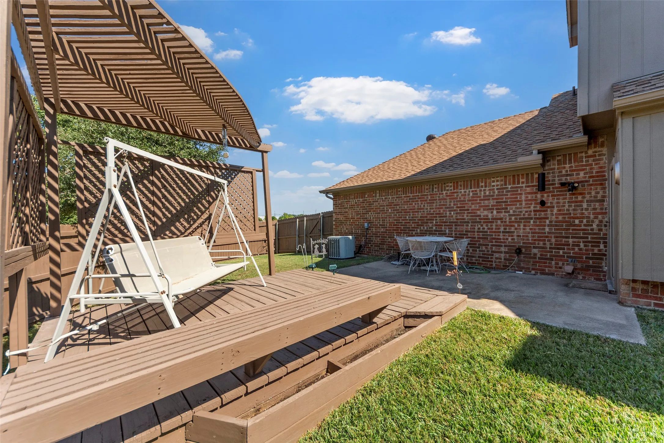 Enjoy this large backyard with wonderful deck