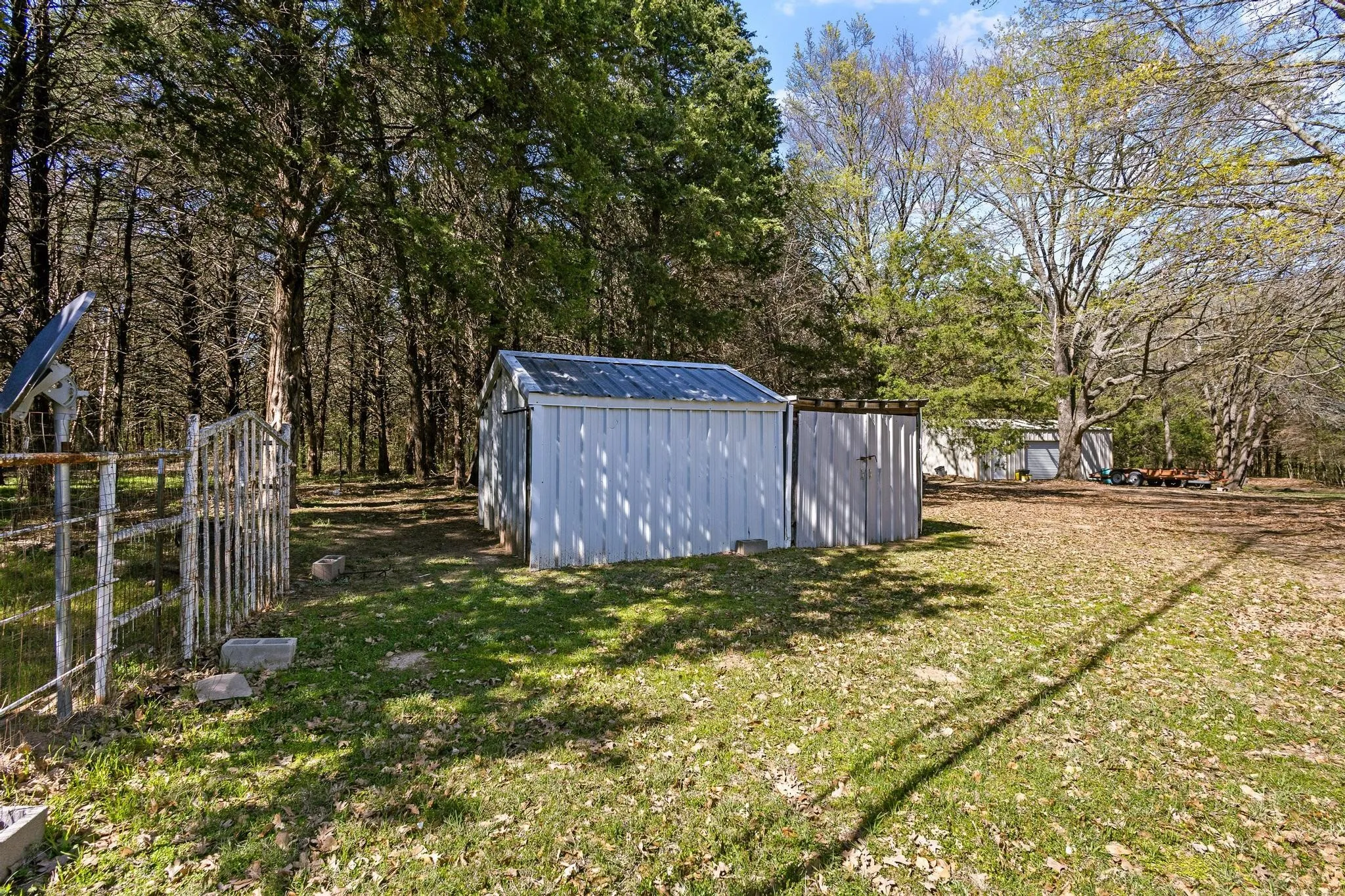 Storage buildings by side of the house