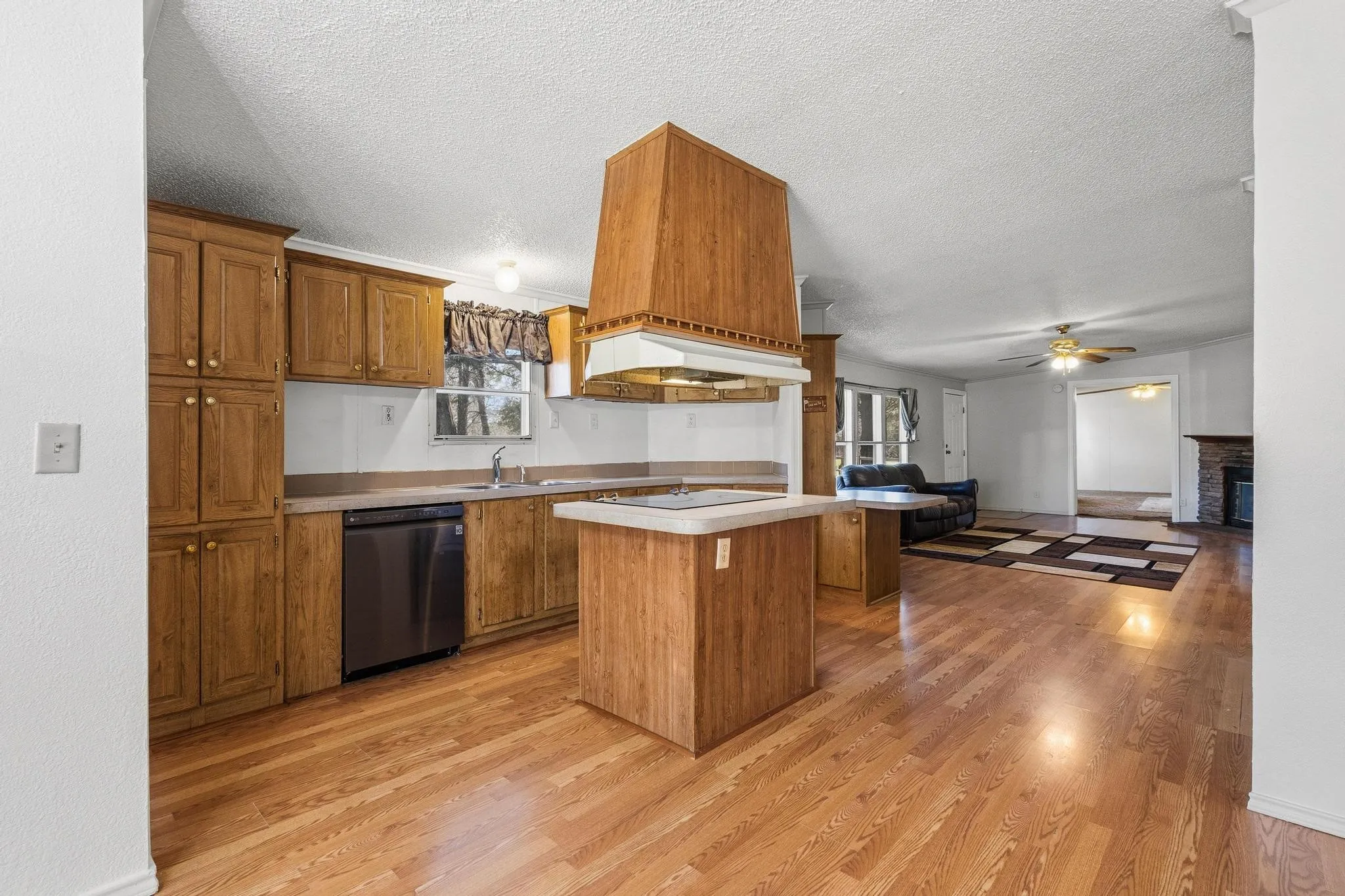 Island cooking area and pantry in kitchen