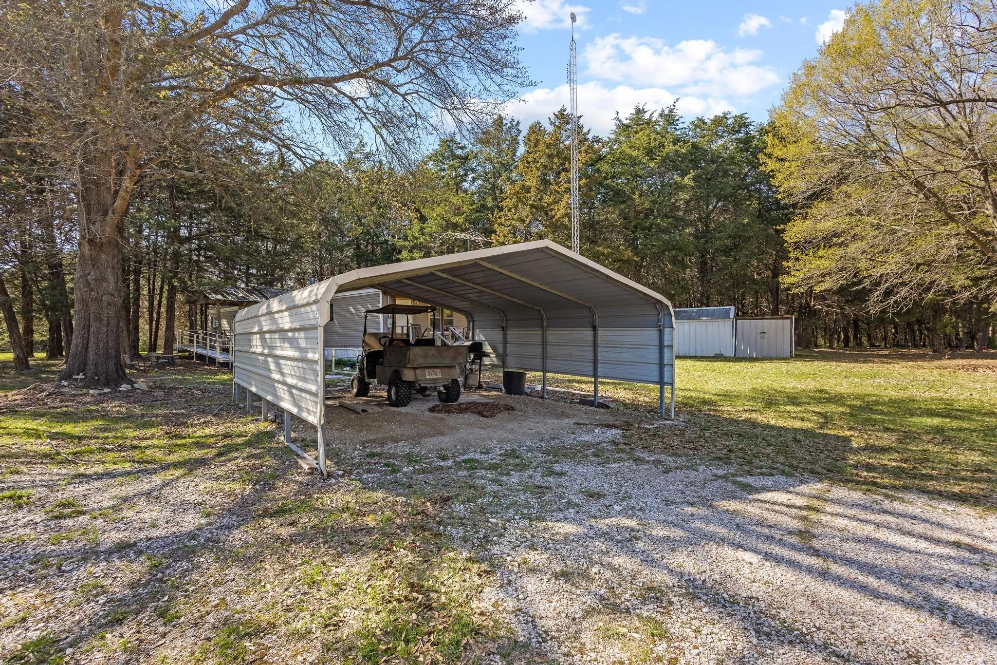 Carport by the ramp to the front door.