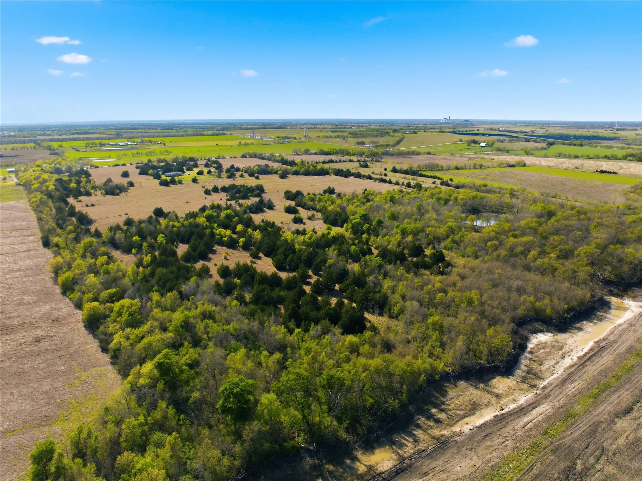 Aerial view of sparsely populated area featuring abundant farmland