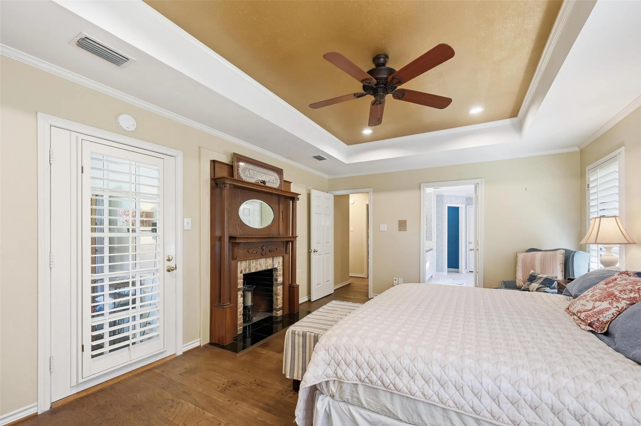 Primary Bedroom with a Fireplace