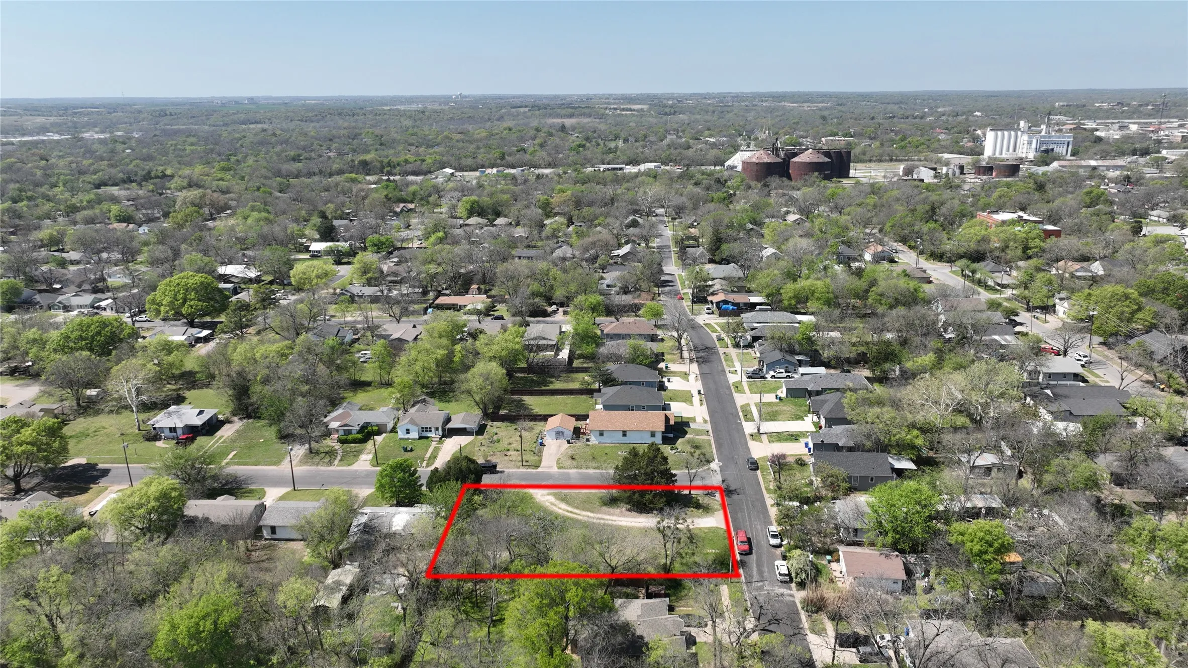 Aerial perspective of suburban area with property boundaries highlighted