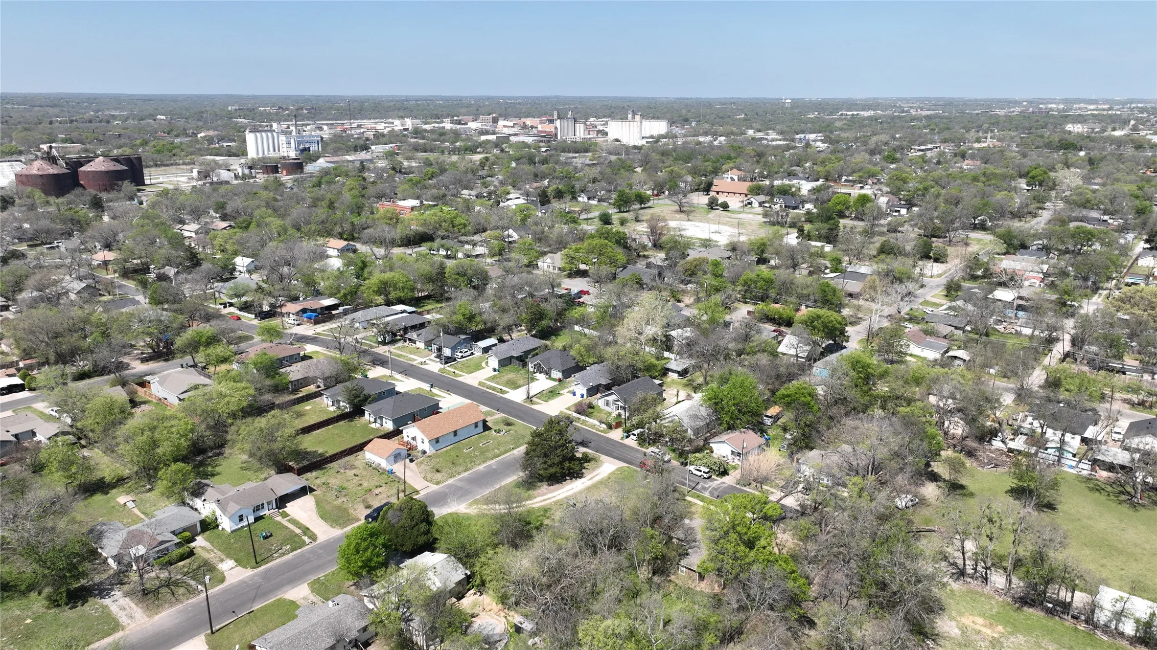 Aerial overview of property's location featuring nearby suburban area