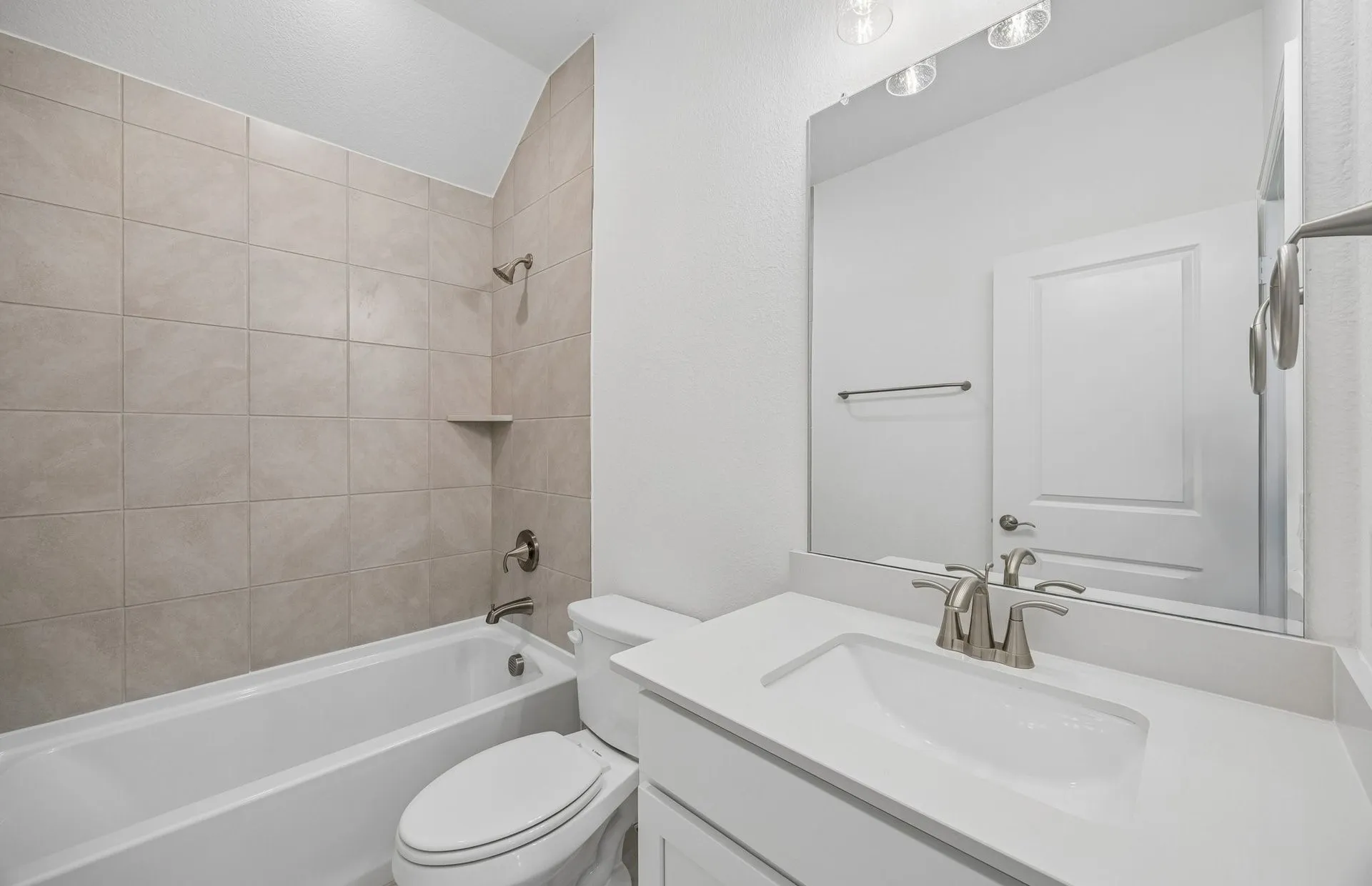 Secondary bath with tile surrounded shower
