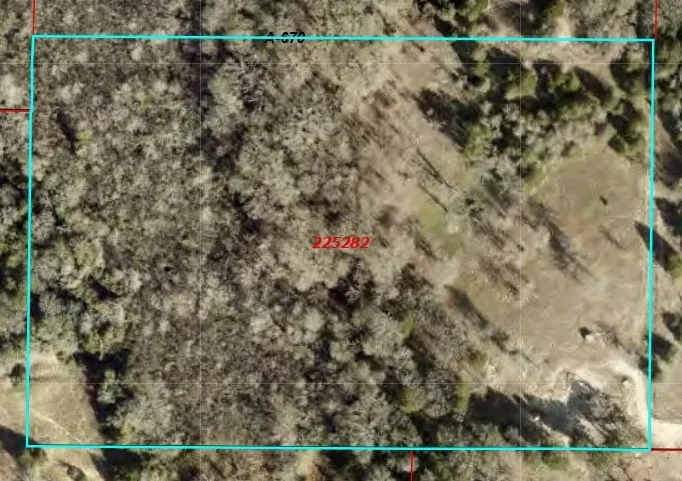 Aerial map of property and surrounding area featuring property parcel outlined