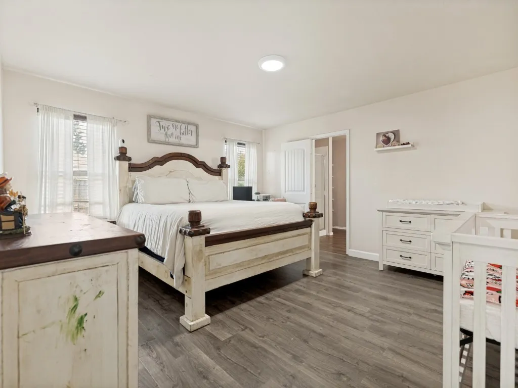 Retreat to a spacious primary suite designed for comfort and relaxation. Featuring abundant natural light, generous floor space, and room for a sitting area or nursery, this private sanctuary offers the perfect place to unwind at the end of the day.