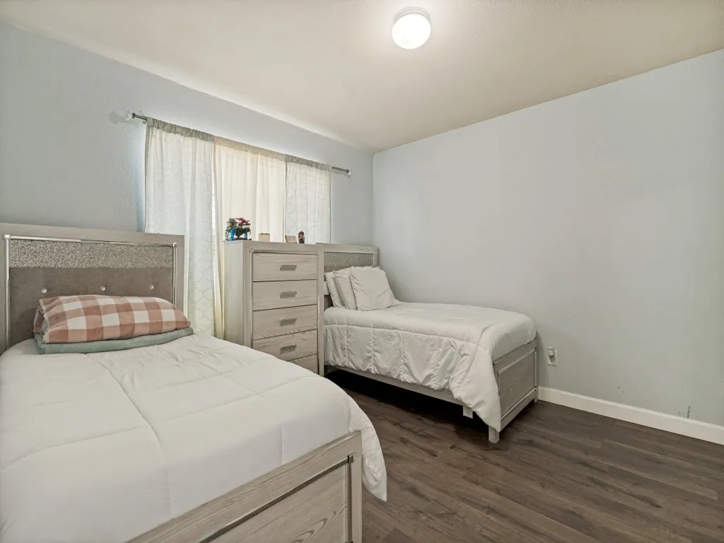 Separated from the secondary bedrooms, this front-facing room offers flexibility as a guest retreat, office, media room, or play area.