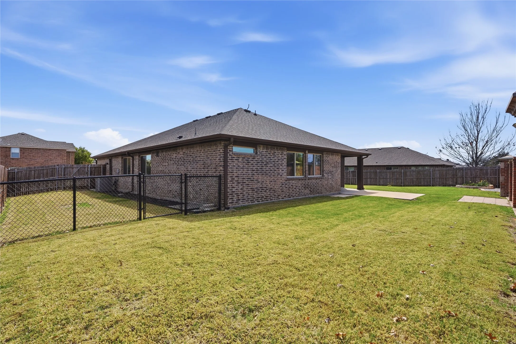 Large lot that allows for plenty of space to include a dog run on the side of the house.