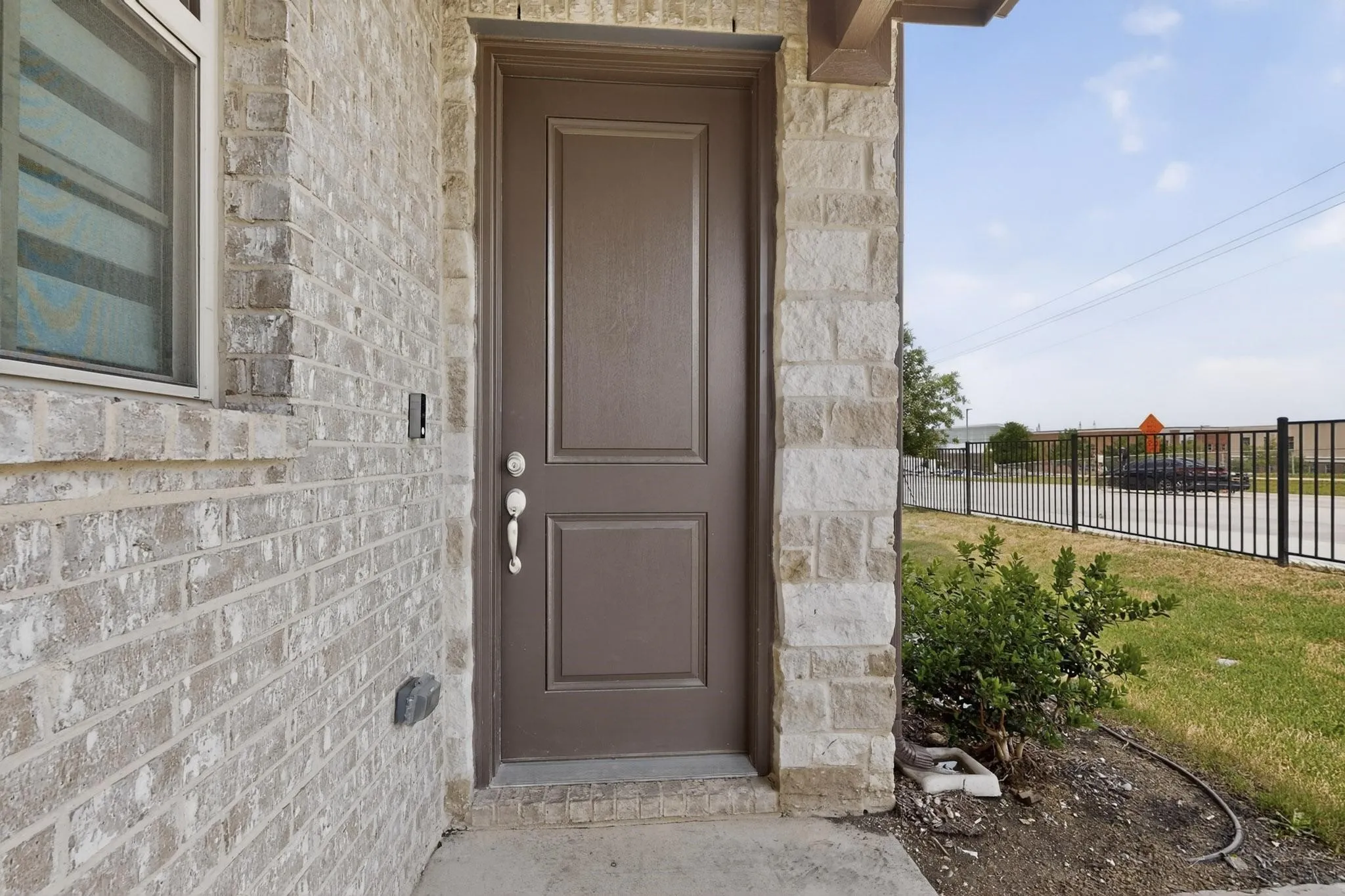 Covered entry with paneled door