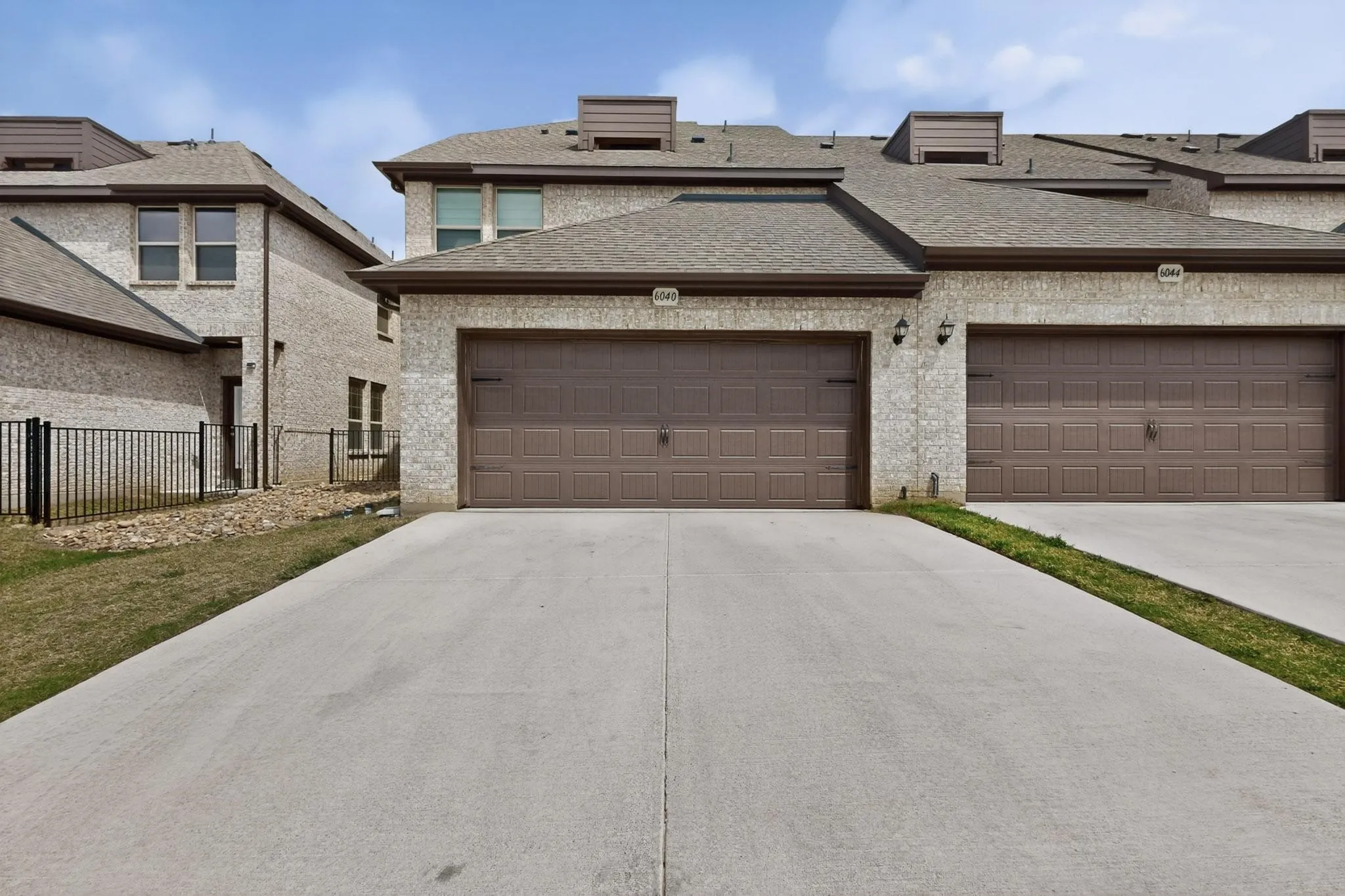 Light brick exterior with rear-entry garage