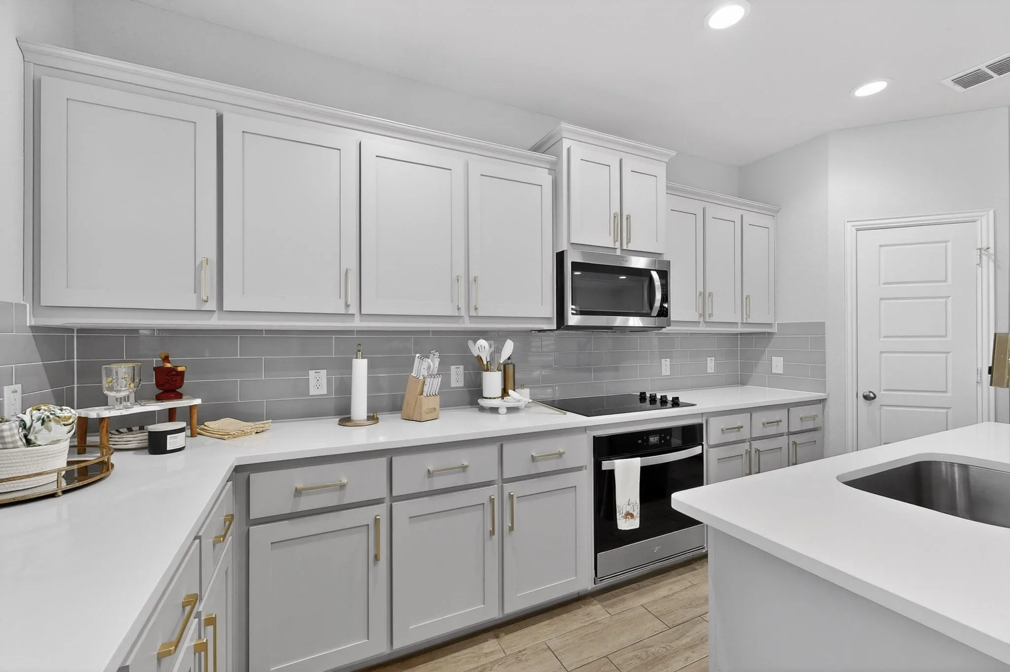 Kitchen in soft grey with gold hardware - on-trend and easy to love