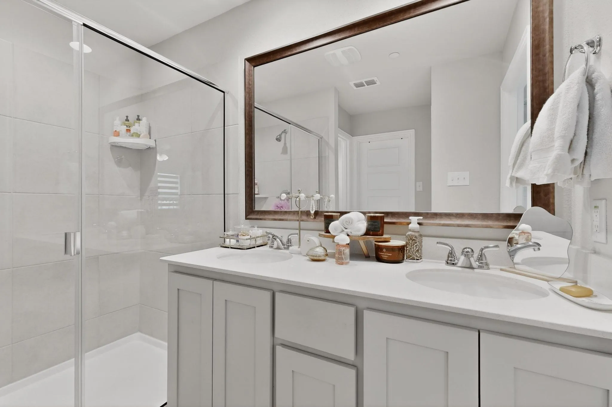 Walk-in glass shower in the primary bath