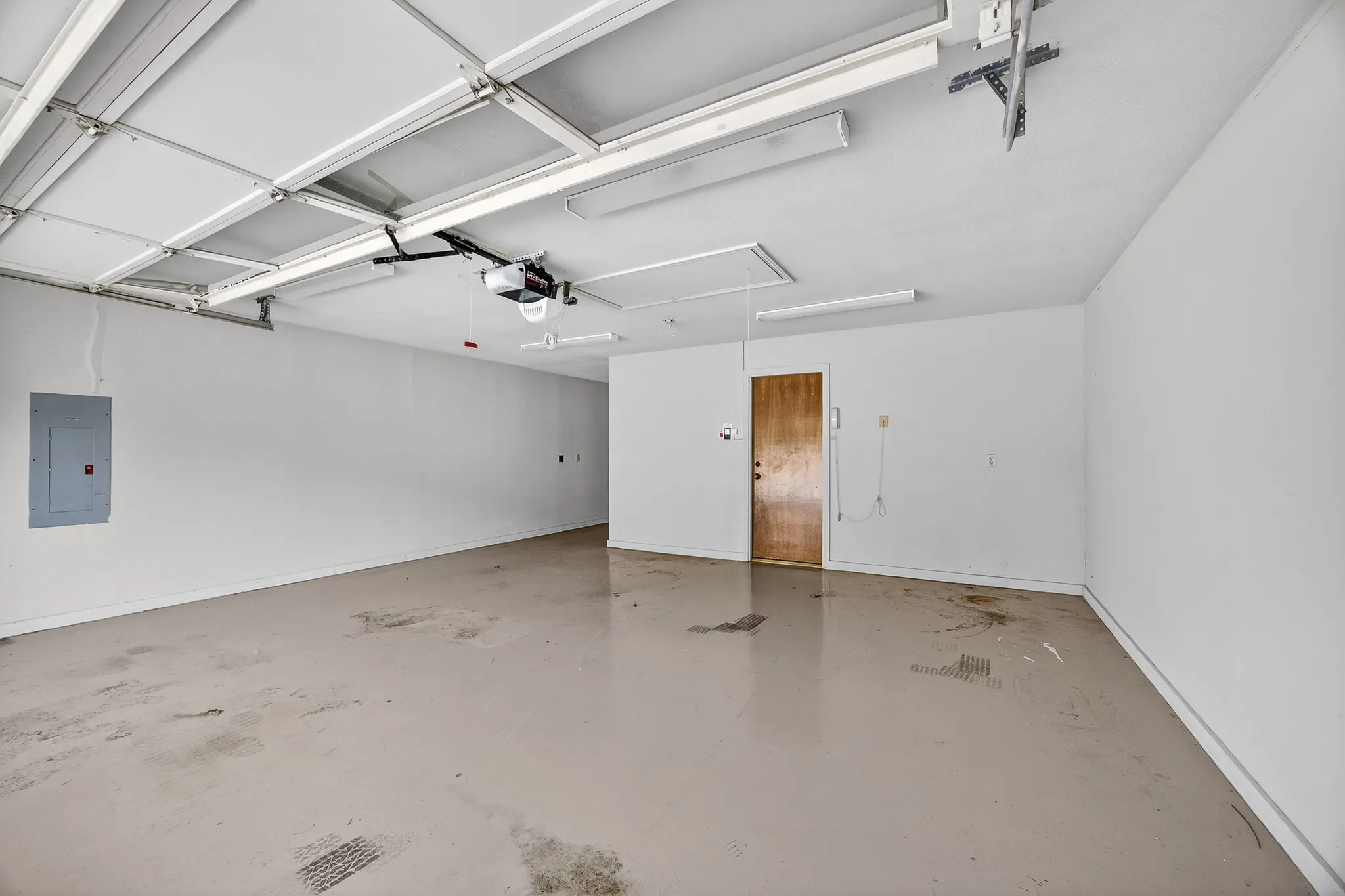 Over sized garage with extra storage space and attic