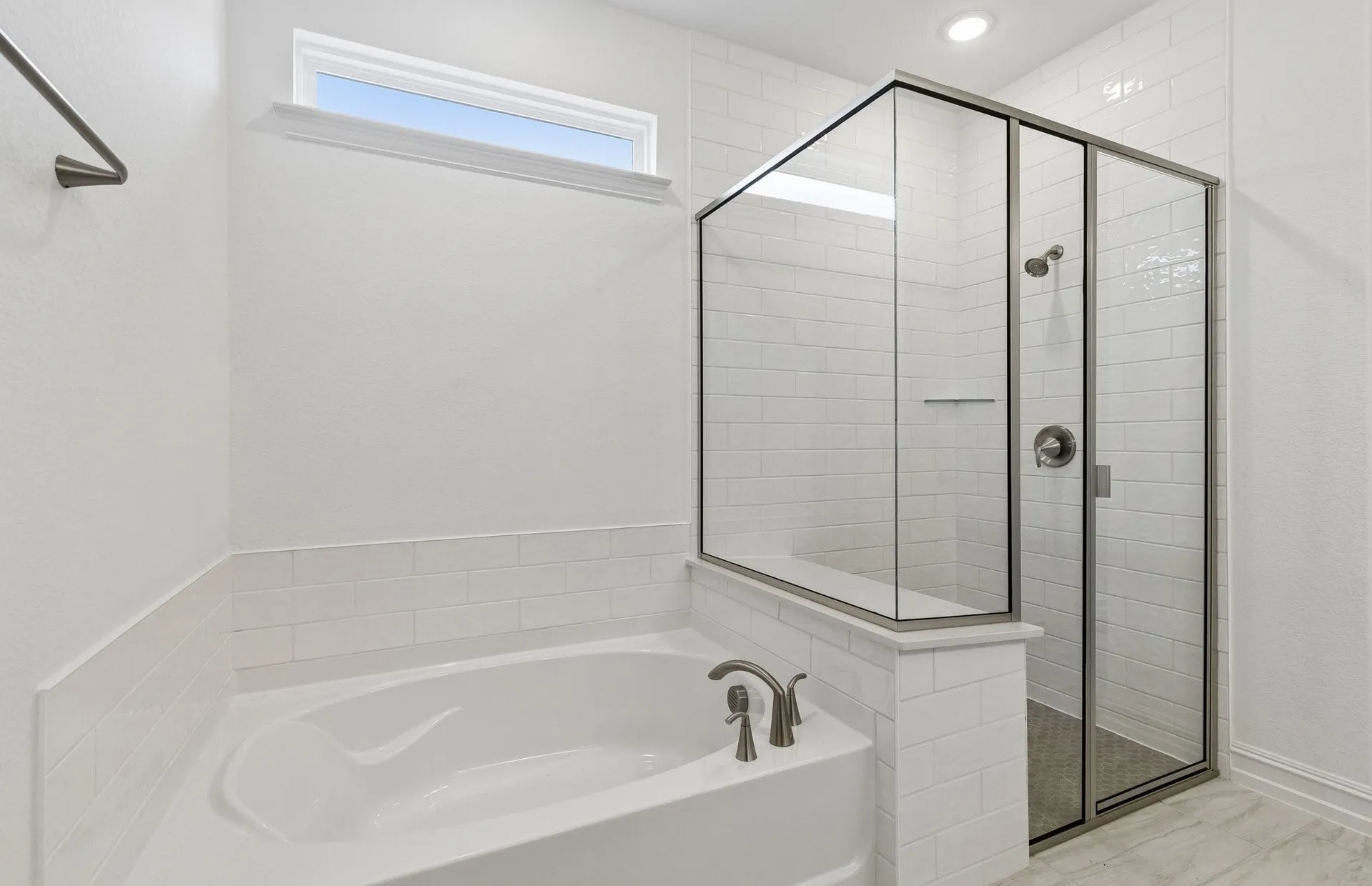 Separatee tub and shower in owners bath