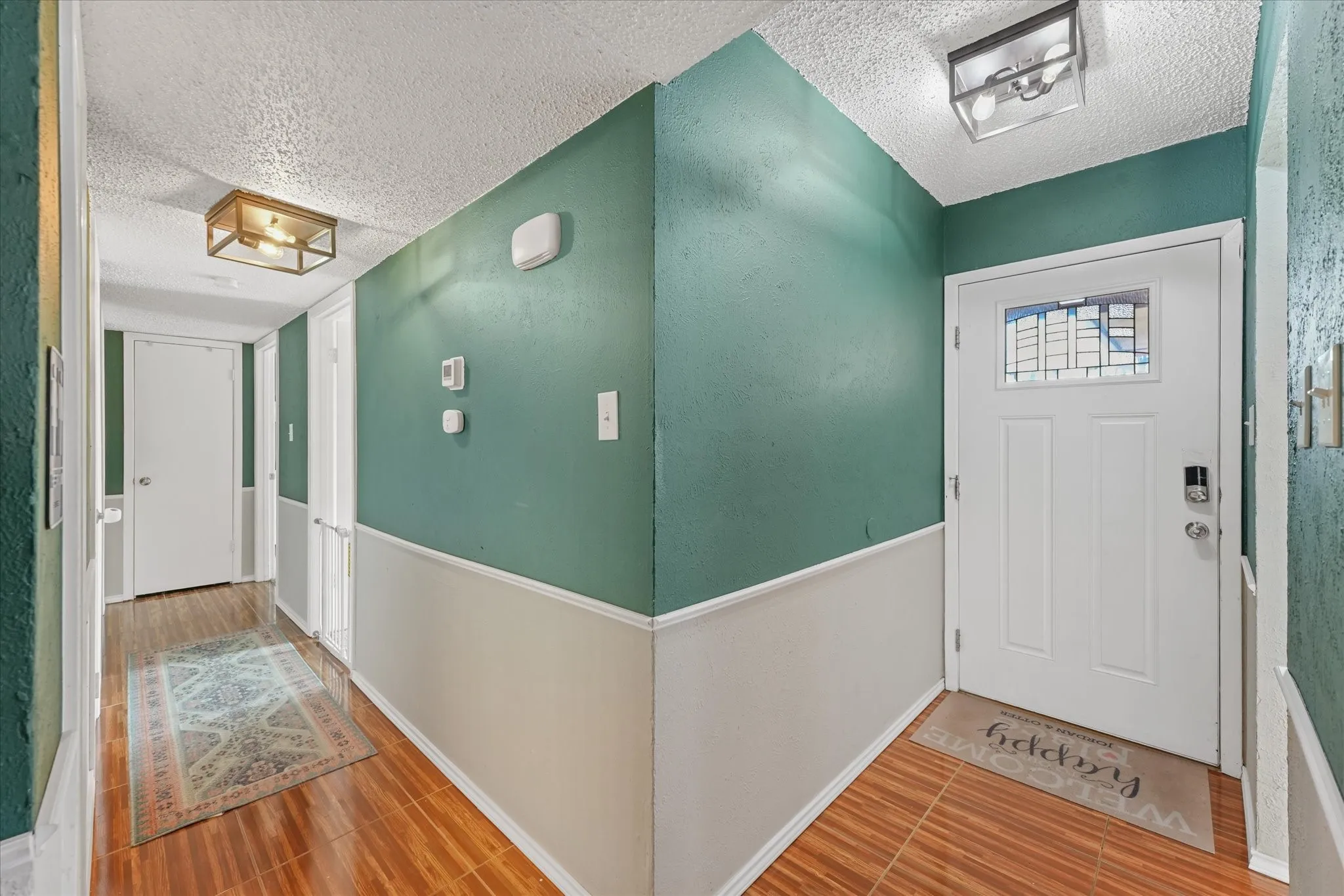 Entry hallway with welcoming layout with easy flow into main living areas.