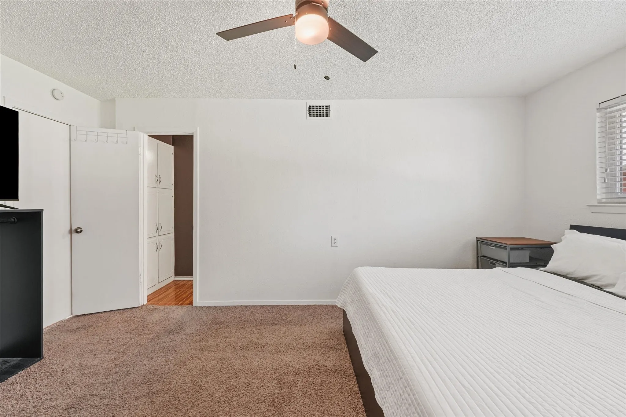 Generously sized primary suite with easy flow to adjacent spaces and ample wall space for furniture placement. Comfortable layout designed for everyday living.