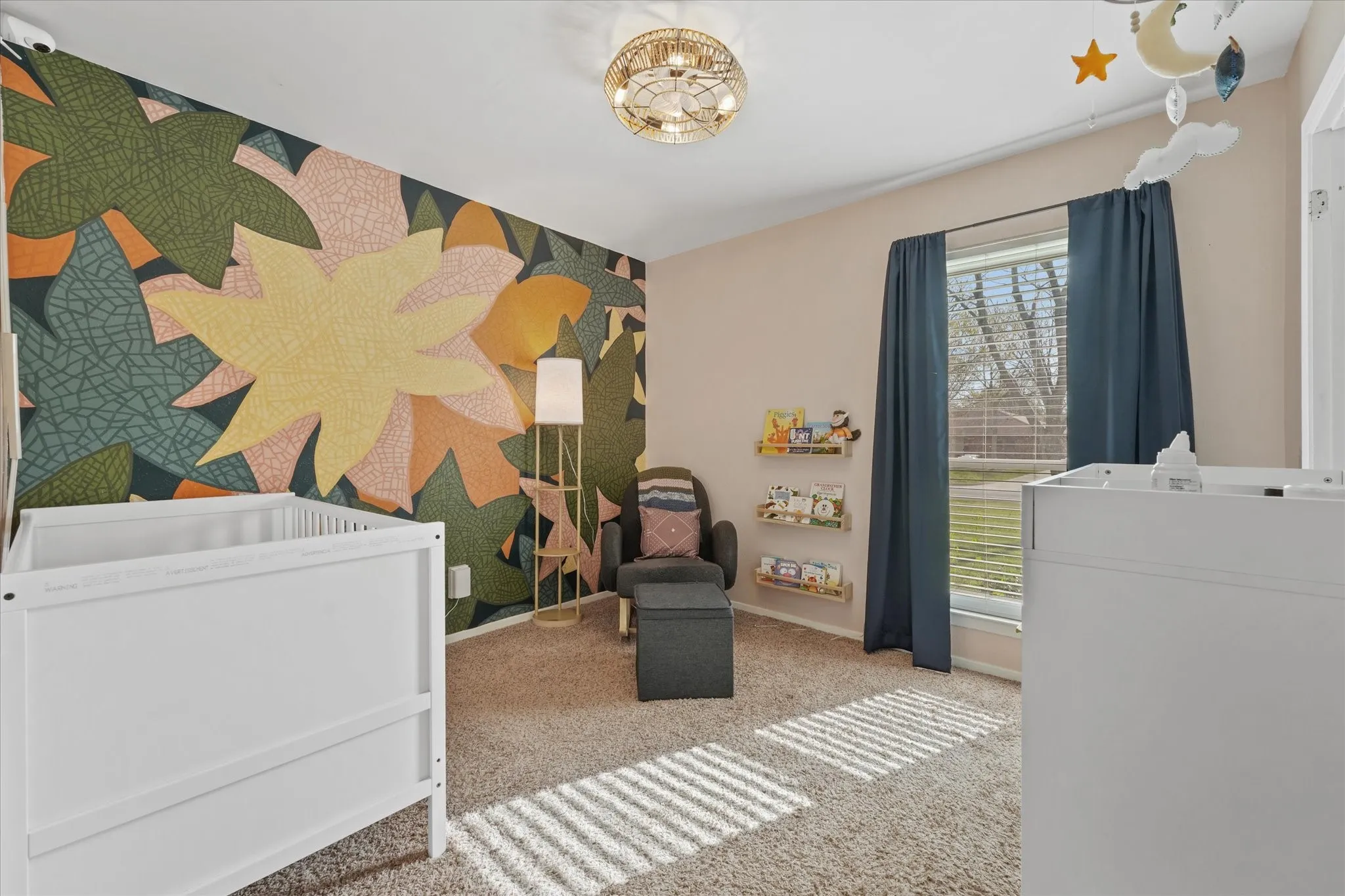 Stylish secondary bedroom with designer accent wall, natural light, and cozy layout—perfect for a nursery, kids’ room, or creative space. Move-in ready with updated lighting and modern touches.