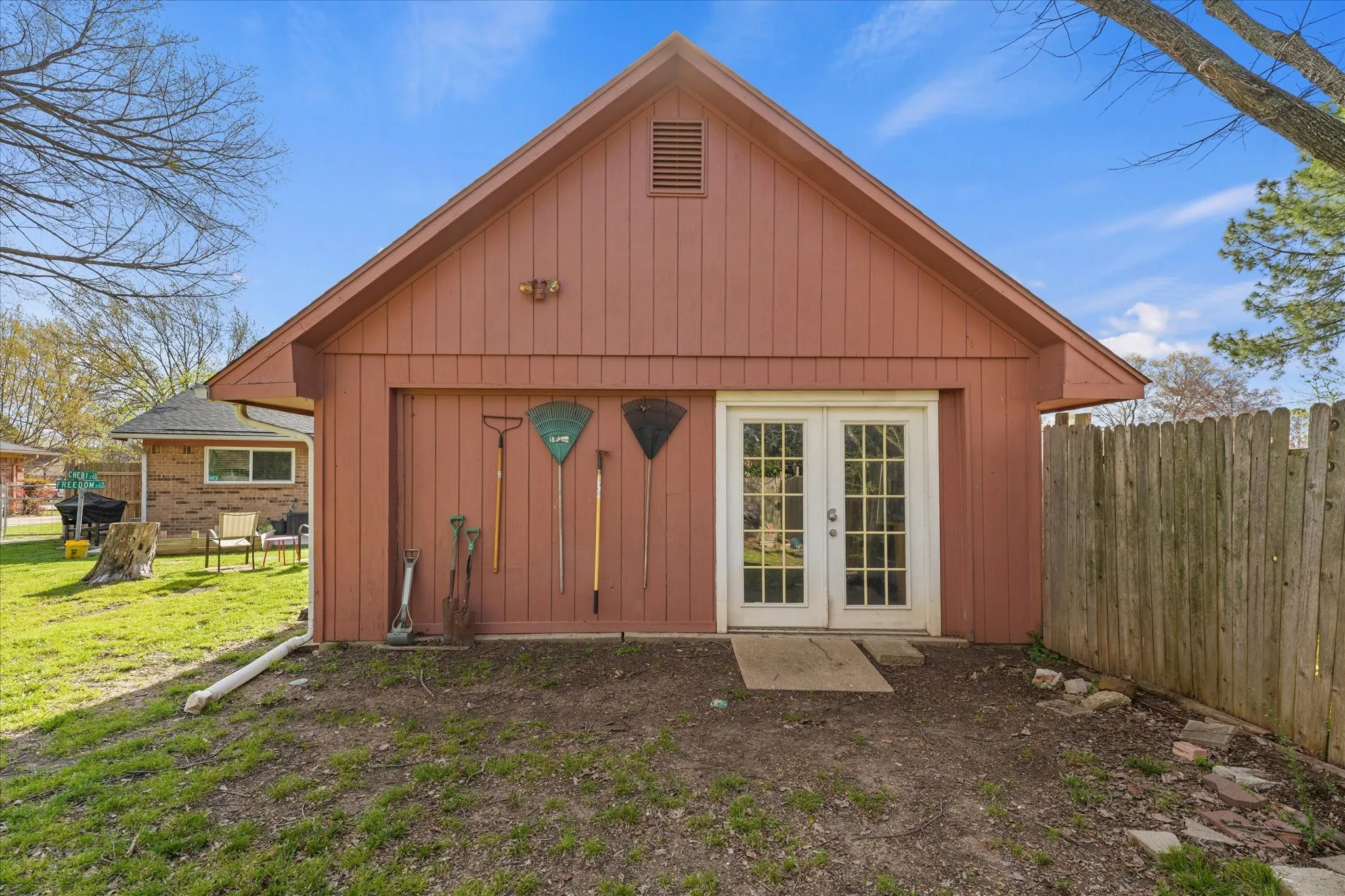 Detached workshop with double doors and dedicated workspace—ideal for projects, home business use, or extra storage. A standout feature for buyers needing versatility.