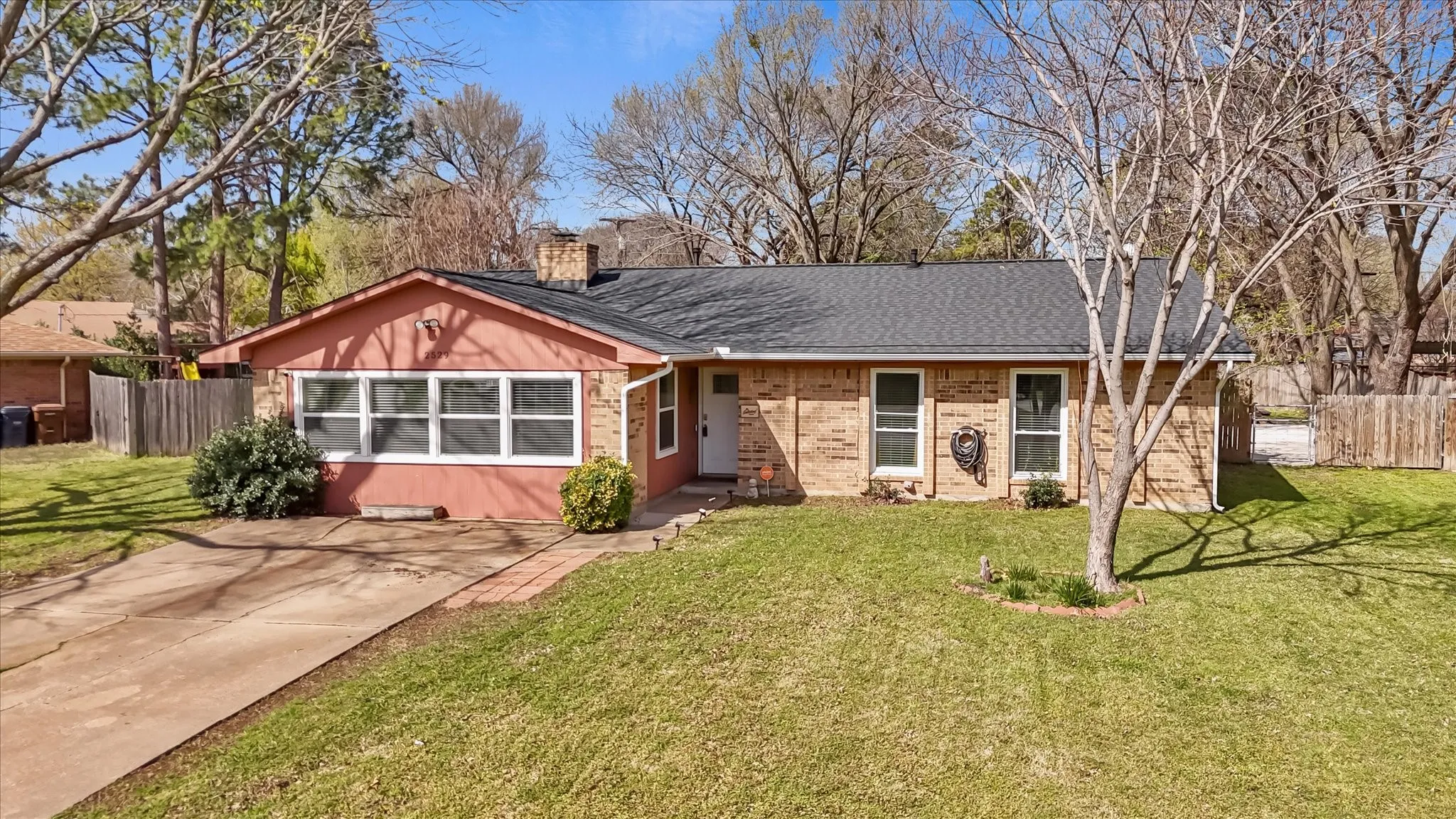 Large lot with mature trees offering privacy and space—hard to find in Denton TX at this price point.