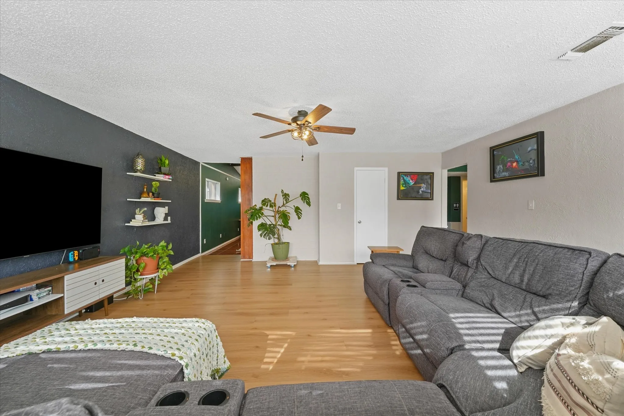 Flexible living space with room for multiple seating areas, home office setup, or media room.