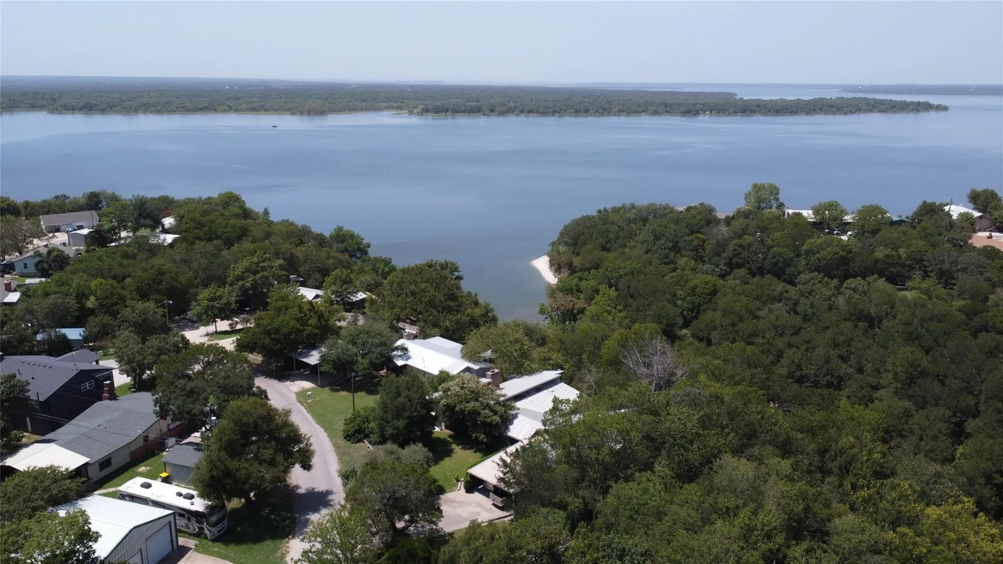The lake comes in  near the house. Lower right and the trees are spectacular.