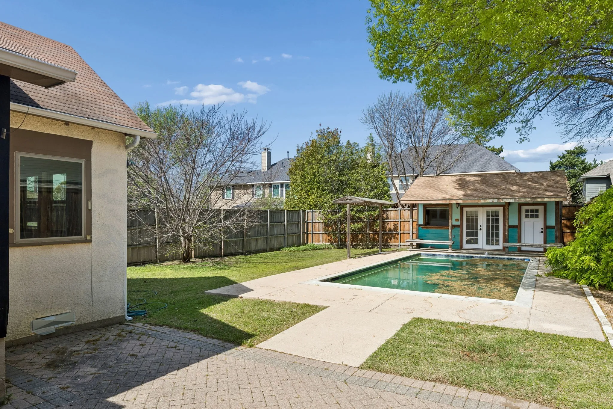 Pool and extra large backyard with pool house and storage
