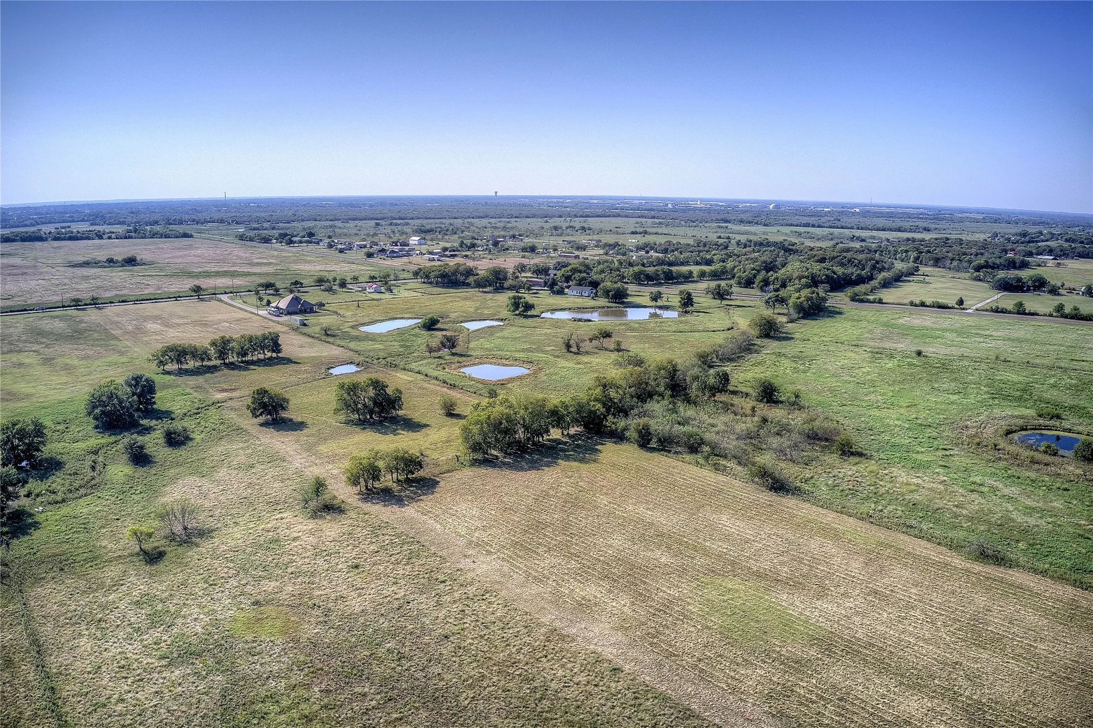 Aerial view of sparsely populated area with a large body of water