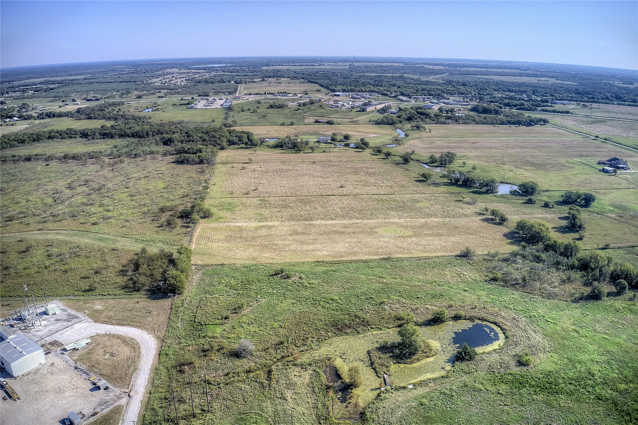 Aerial view of property's location with rural landscape