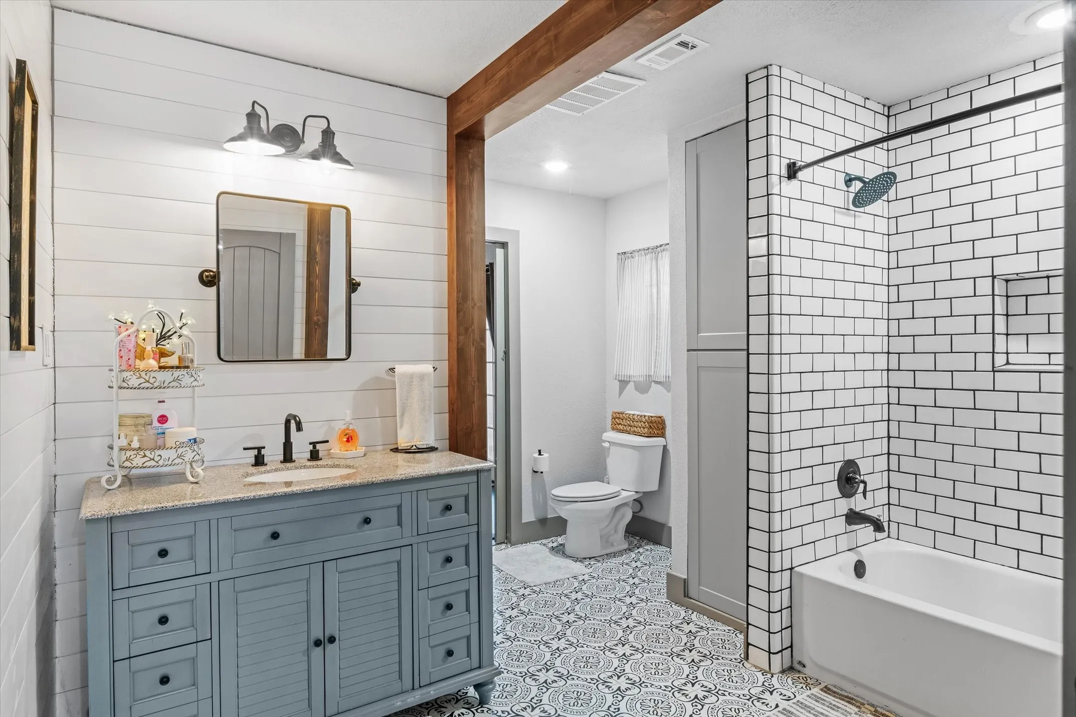 Full bath featuring vanity, bathing tub / shower combination, and recessed lighting