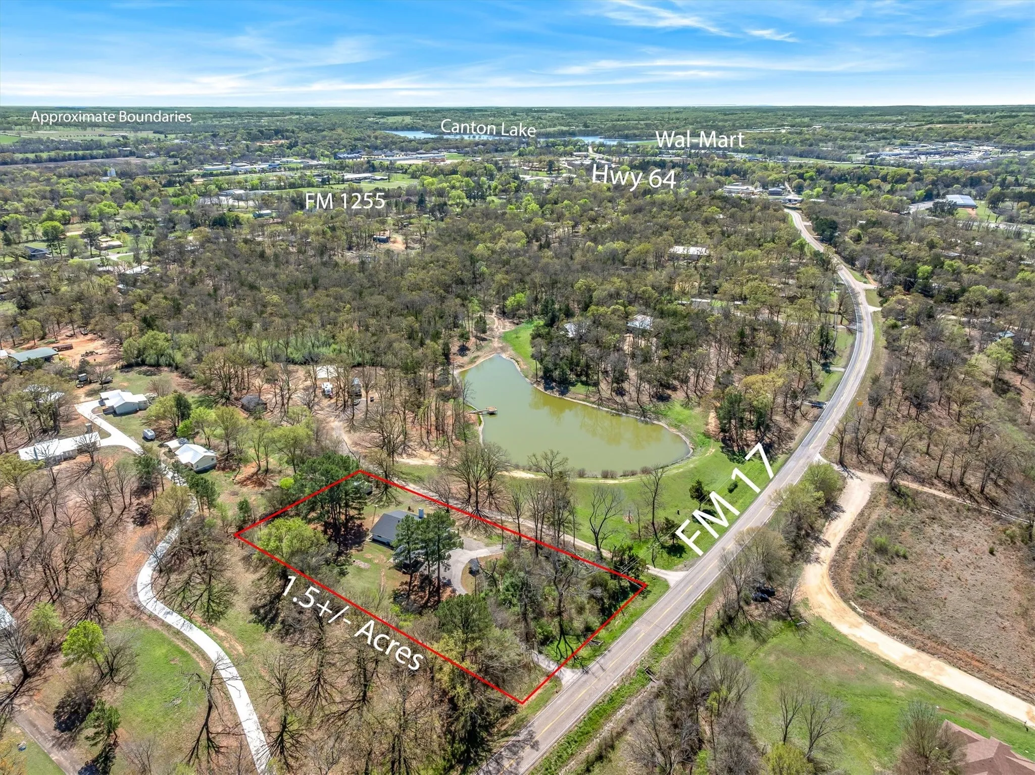 Aerial overview of property's location with property parcel outlined and a nearby body of water