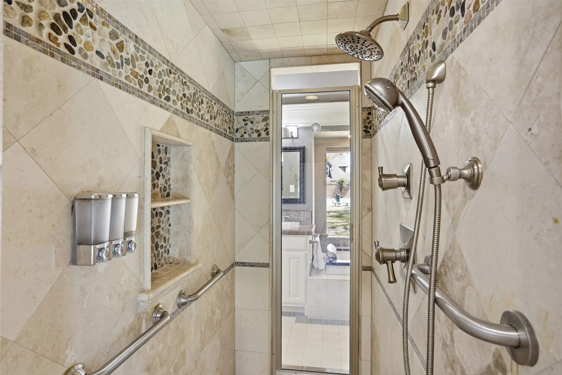 The walk in shower in the primary bathroom.
