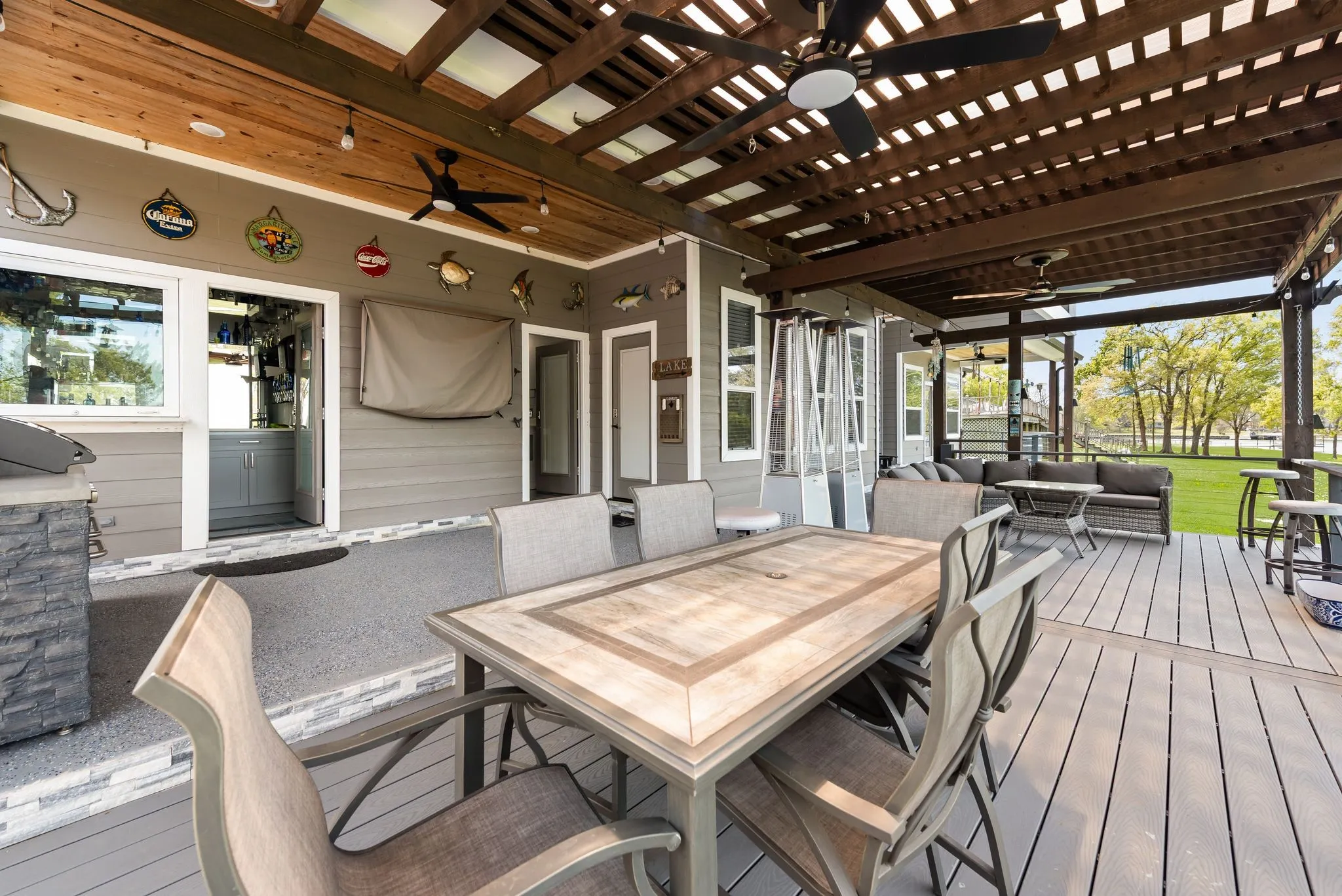 Outdoor dining area under the covered patio, ideal for entertaining after a day on the lake.