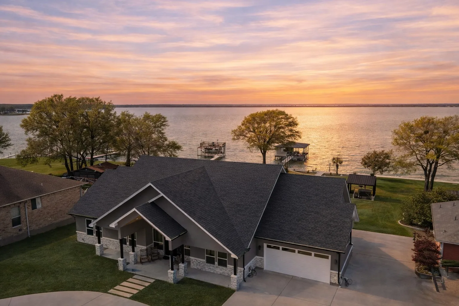 Aerial sunset view of this Richland Chambers Lake waterfront home in Rustling Oaks Estates.