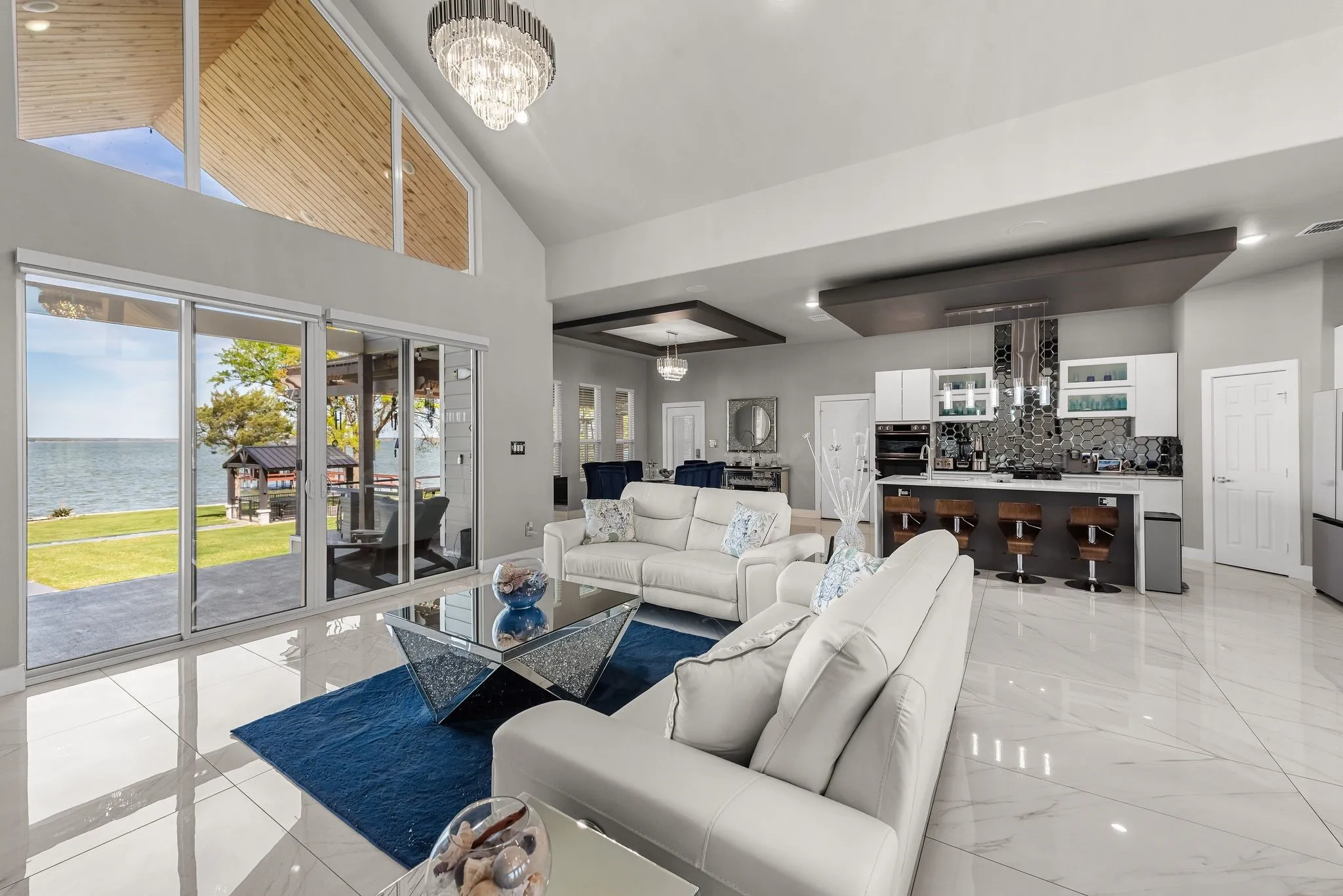 Lake-facing living area with large windows overlooking Richland Chambers Lake.