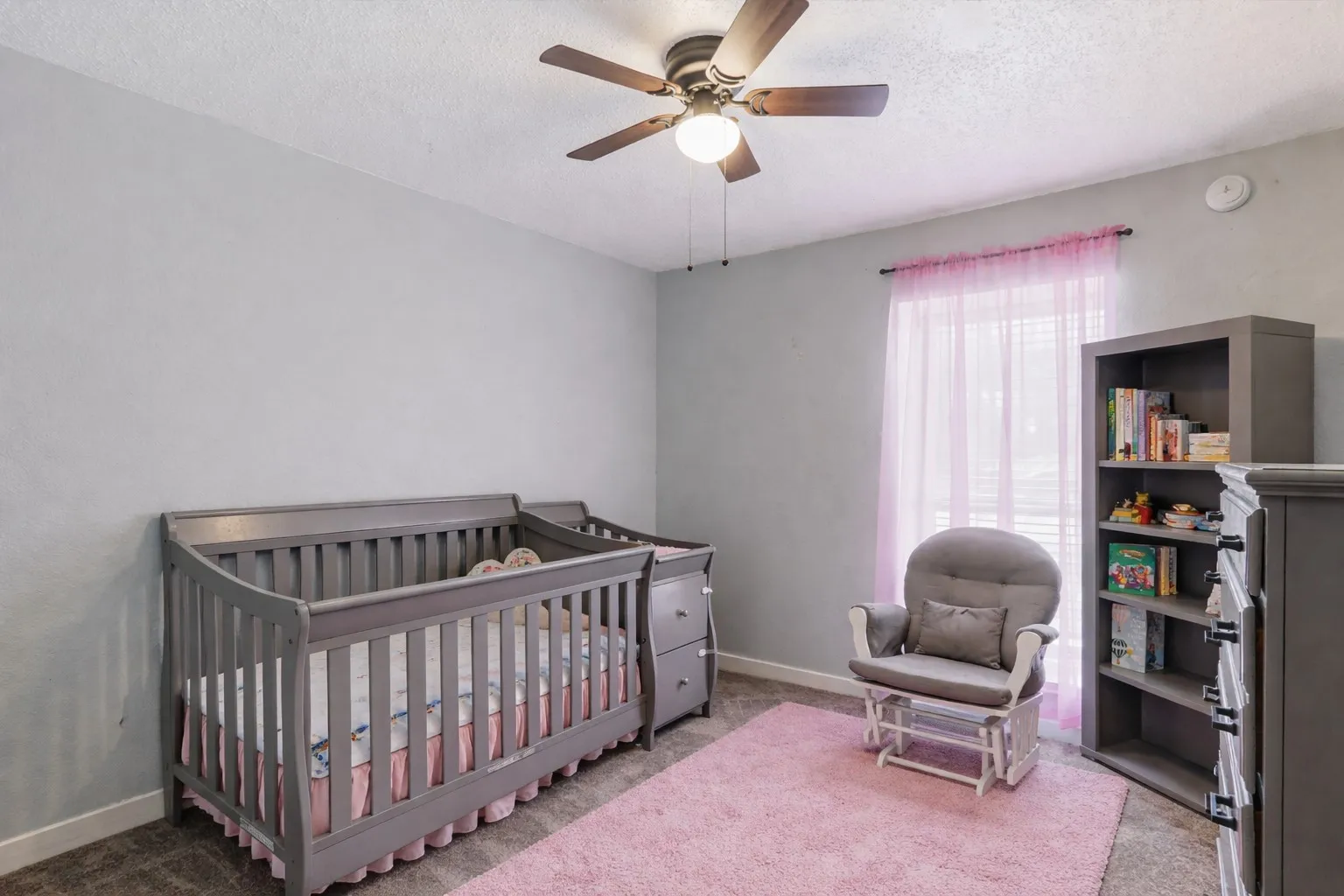 Soft natural light and calming tones create a peaceful atmosphere in this inviting space. Perfect for a bedroom, nursery, or quiet workspace, it offers flexibility to fit your lifestyle as it evolves.