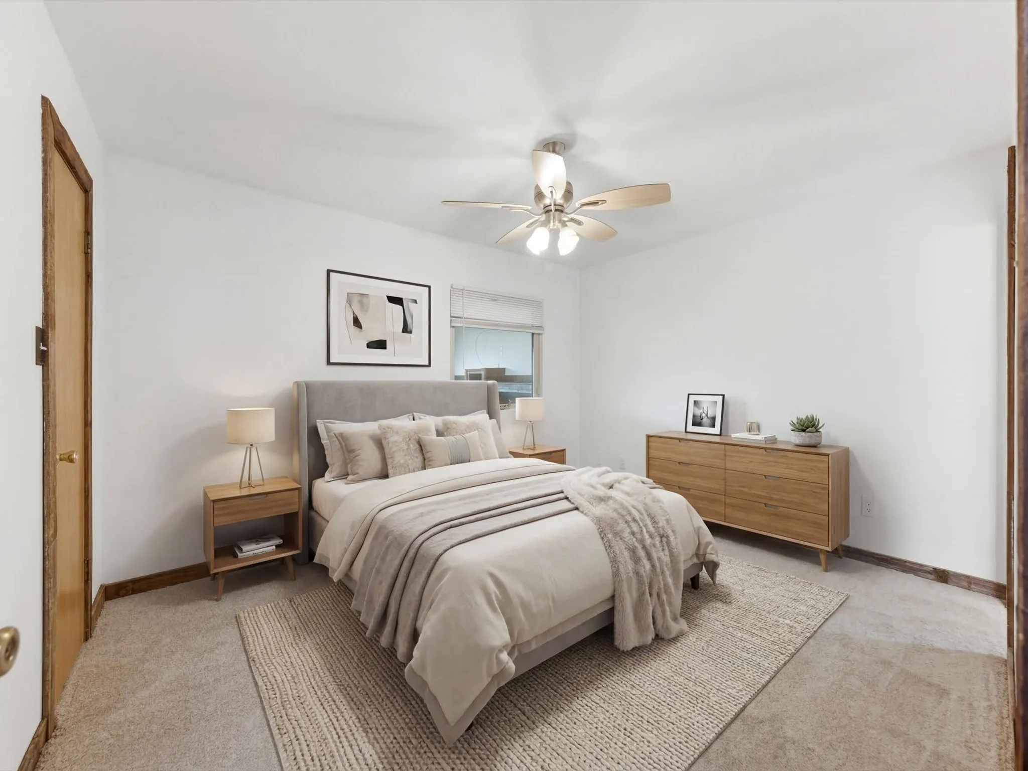 VIRTUALLY STAGED!Bedroom featuring neutral carpeting, white walls, a ceiling fan with light fixture, and a window with blinds