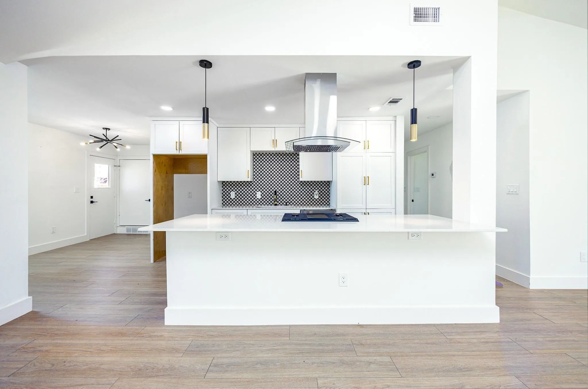 Island kitchen opens to the main living space