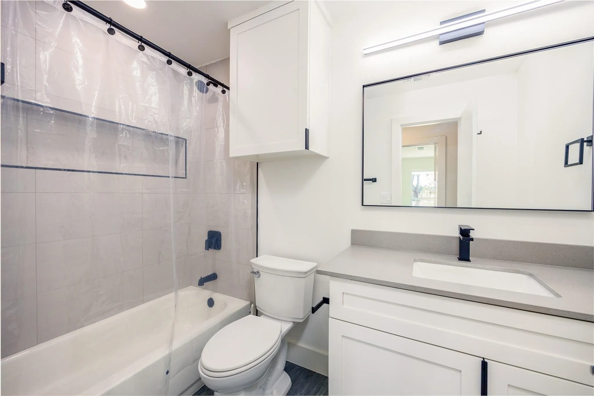 Fresh full bath with new tub and custom tile