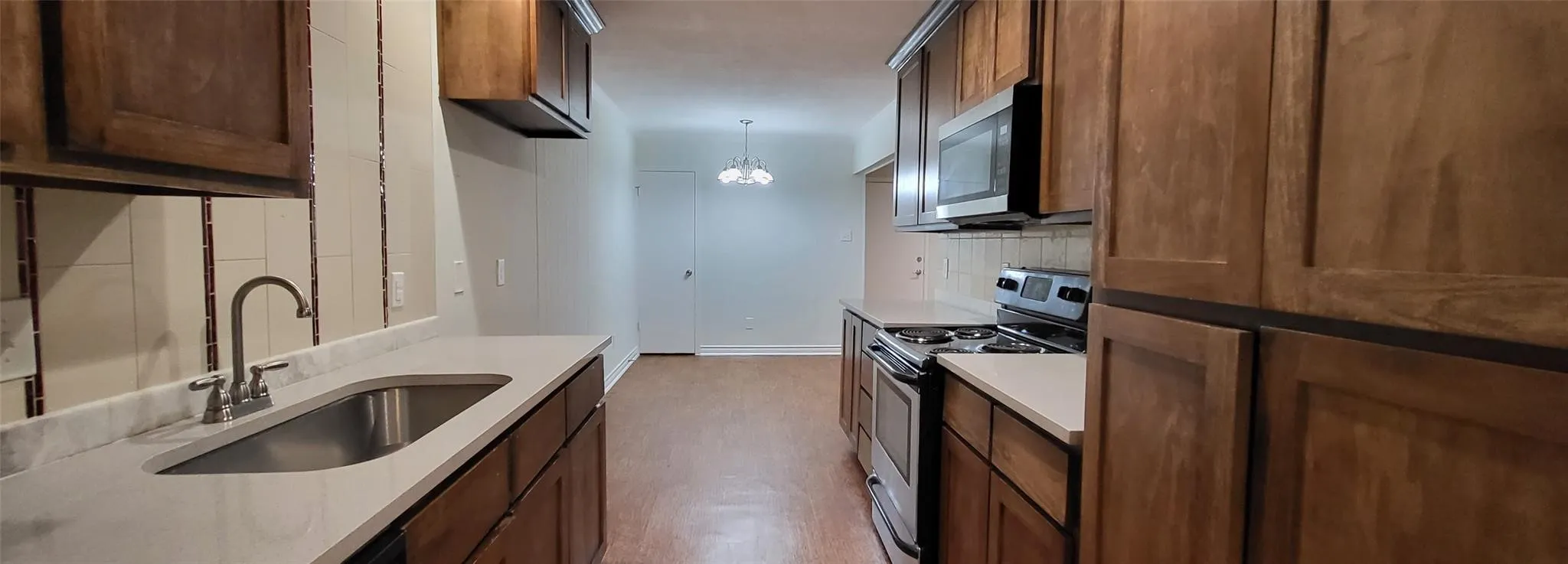 Functional kitchen with warm wood cabinetry