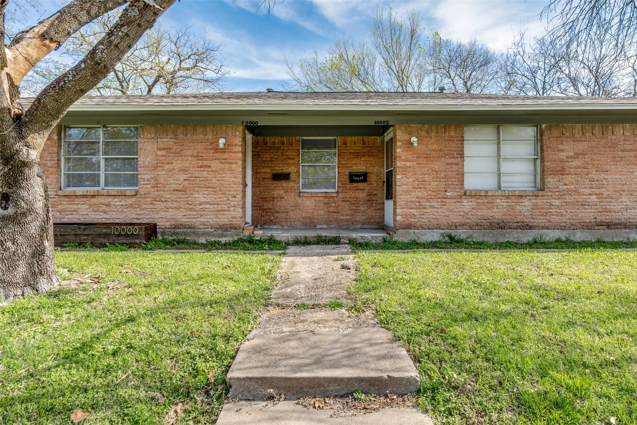 Brick exterior with a covered entry