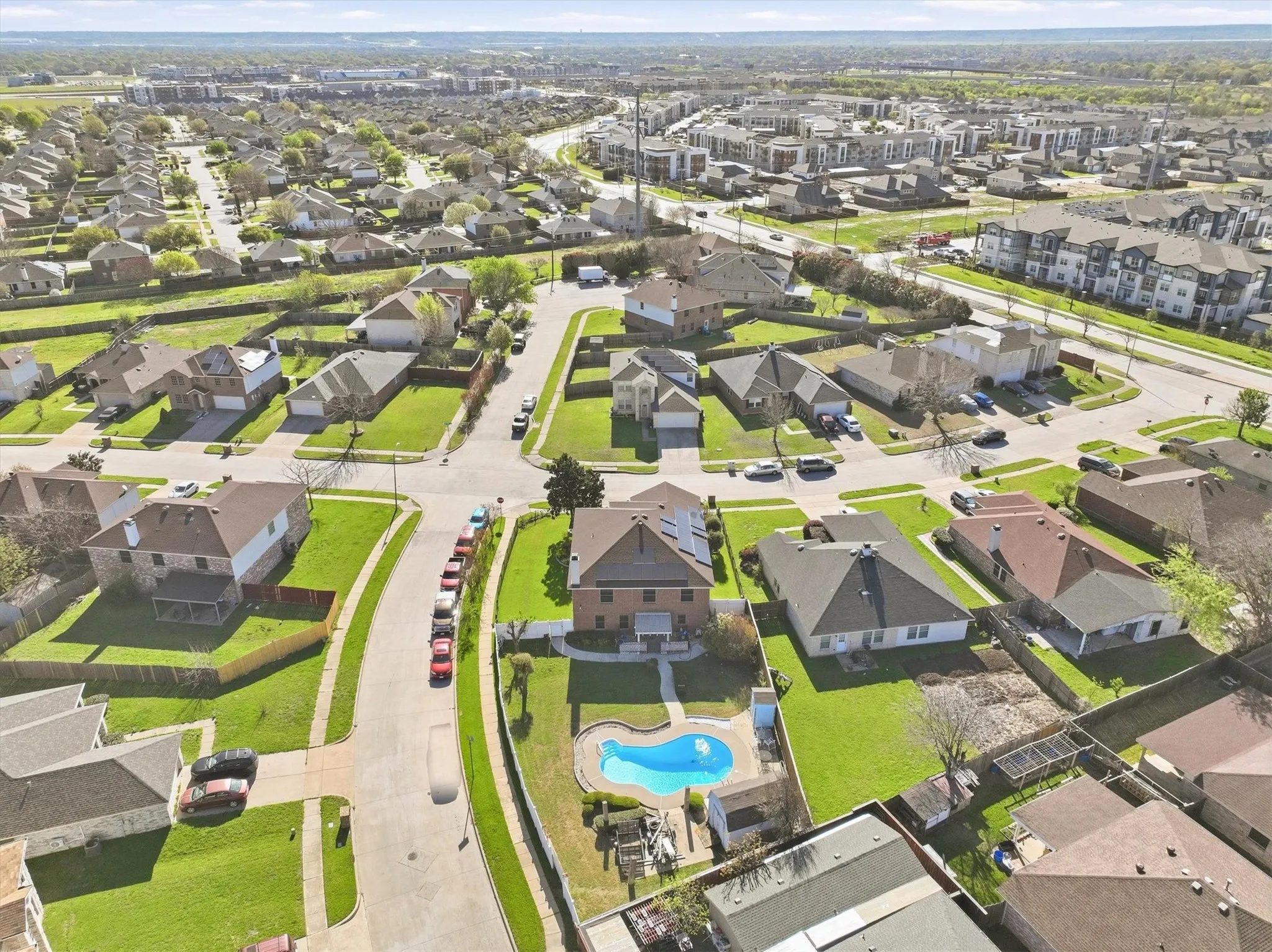 View of property location with nearby suburban area