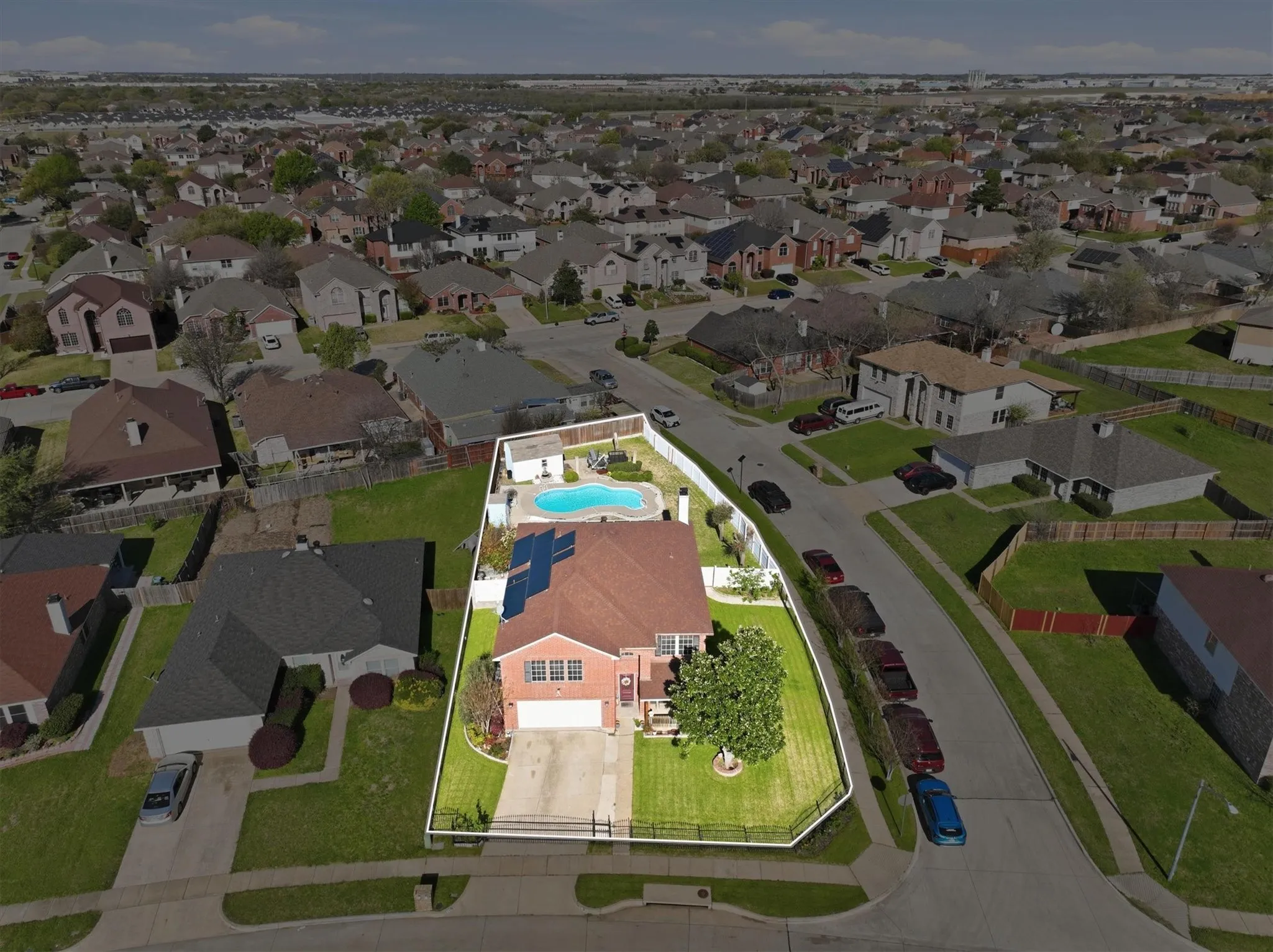 Aerial perspective of suburban area featuring a pool area