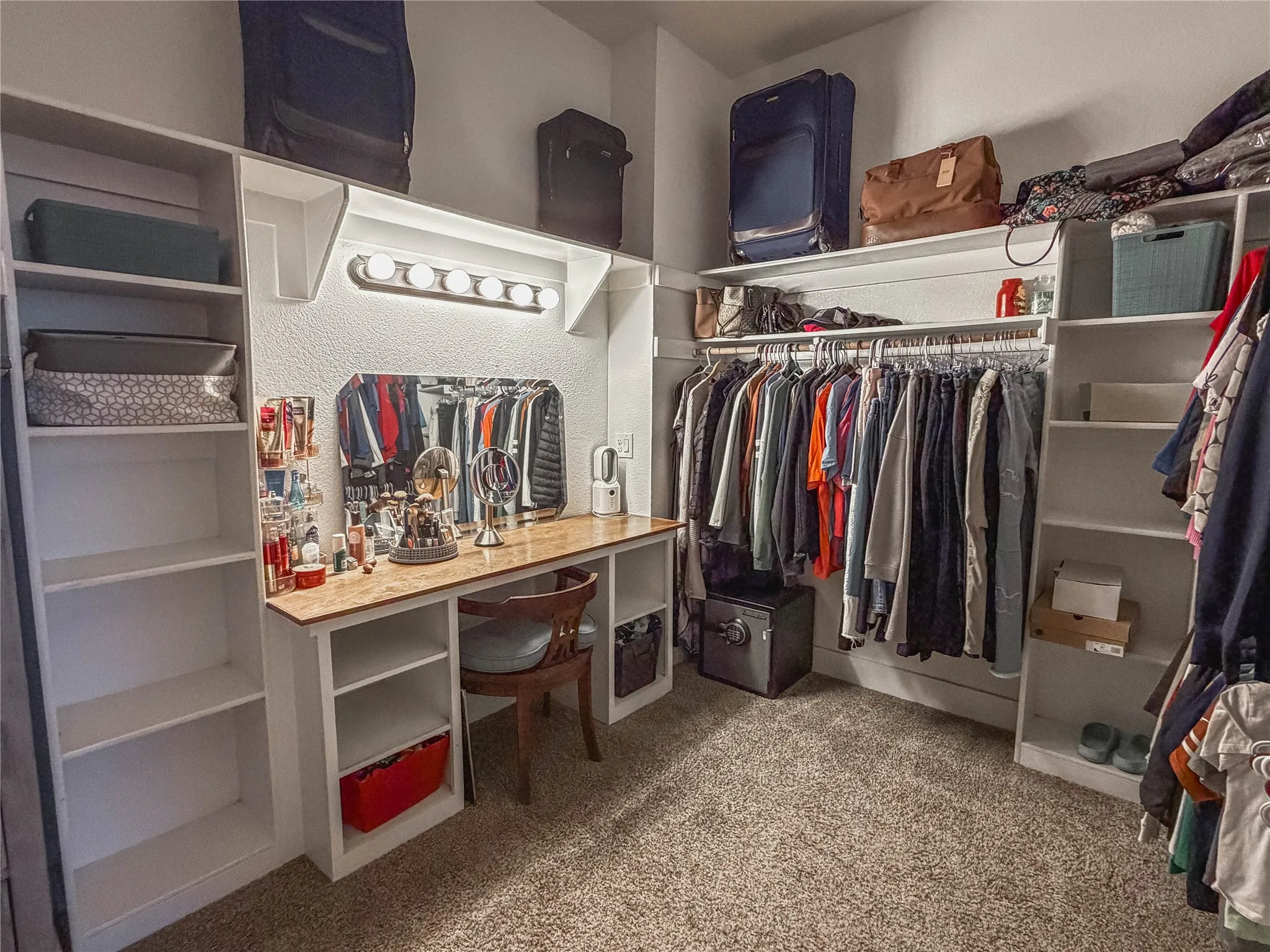 Walk in closet with dark carpet