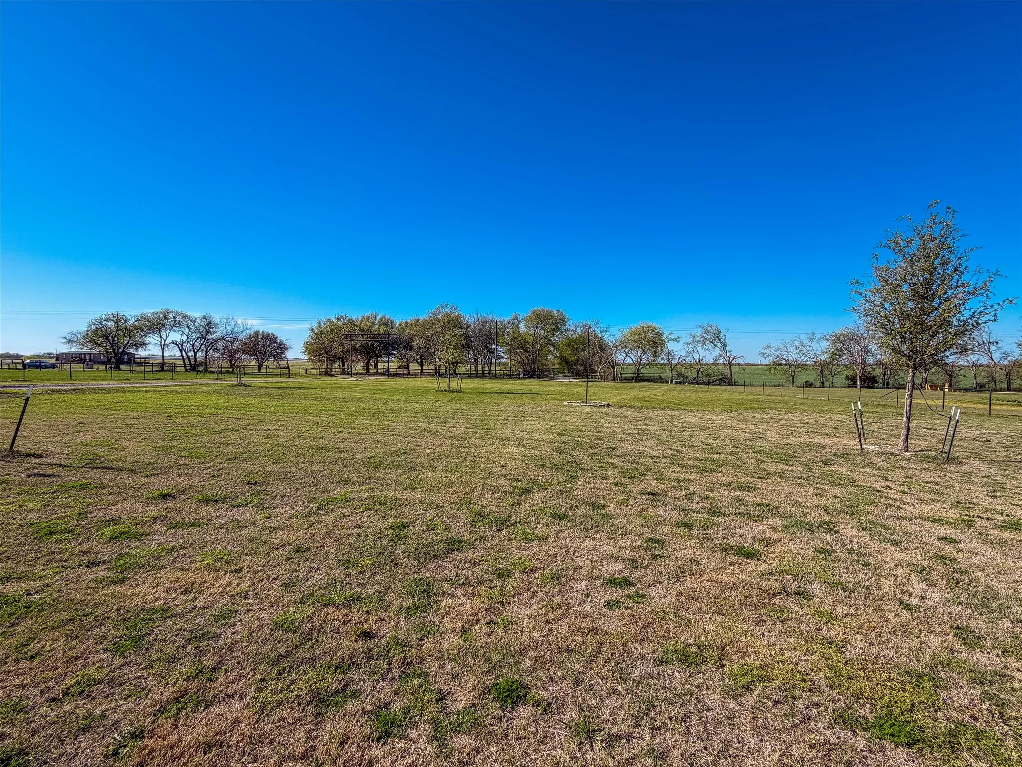 View of green lawn with a view of rural / pastoral area